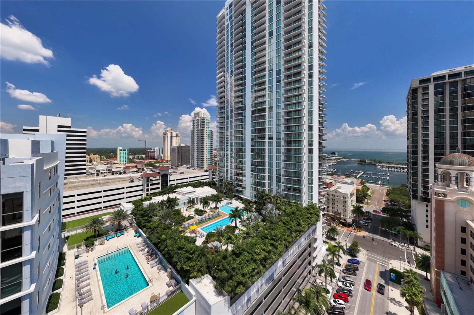 WATER VIEW CENTER UNIT AT ONE ST. Petersburg. ONE St. Petersburg offers resort-style living and provides amenities that are second to none. The 7th floor boasts a Formal Social Room with Tampa Bay water views, a game room with 3 TVs and a billiard table, and a Club Room with a bar that opens directly to the 40,000 Sq Ft amenities deck. Unlike any other property, this resort-style deck includes a 75' lap pool, 12 lushly surrounded cabanas, 2 fire pits, hot tub with waterfall, sunbathing lounge chairs and an outdoor kitchen. Enjoy the 5,000 Sq Ft fitness facility with a yoga room equipped with stationary bicycles and all the equipment a high-end gym would provide. With a 92 rating for walkability, embrace the Downtown St Pete lifestyle and walk to its waterfront parks, marinas, shops, music venues, restaurants, markets, museums, cocktail lounges, the New St. Pete Pier and more…