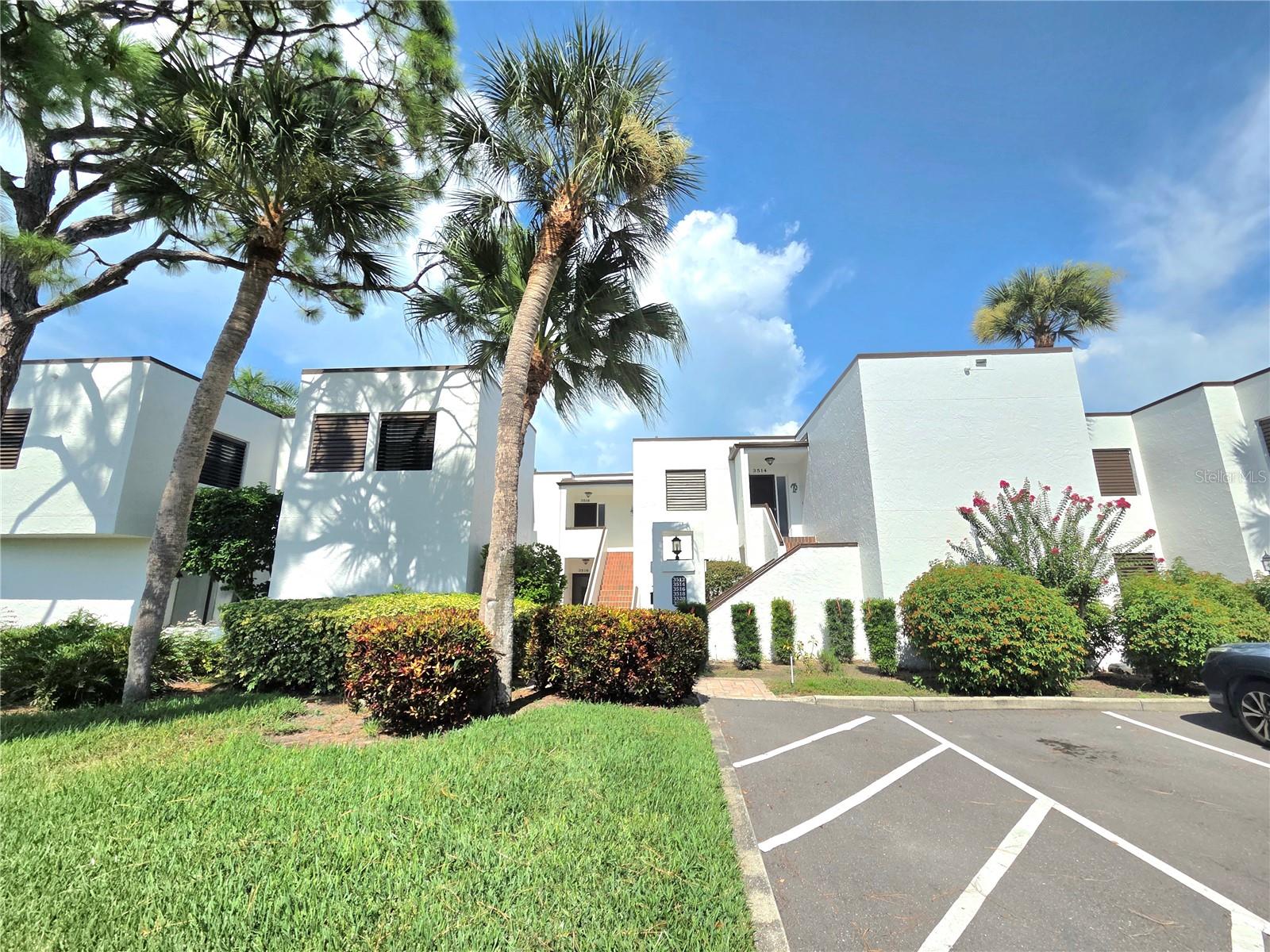 Welcome to your FULLY FURNISHED condominium in the Heronmere I section of the Meadows! This stunning 2-bedroom, 2-bathroom condominium offers breathtaking views of the Meadows Country Club golf course. As you approach your new condominium, you'll be greeted by a well manicured landscaping and a contemporary style exterior. Step inside and prepare to be amazed by this open floor plan.   The well sized kitchen features stainless steel appliances(range, microwave, and dishwasher). The spacious living areas, including the great room, dining room, and enclosed lanai, offer a comfortable and inviting atmosphere. The master bathroom has been tastefully updated to create the complete the experience. The master suite is a true sanctuary, boasting a generous bedroom with a walk-in closet and an updated bathroom featuring updated cabinets, stone countertops, undermount sink, decorative mirror, lights, plumbing fixtures, and custom shower with tiled walls and floor. The guest bath features updated decorative mirror and lighting. Step outside to your very own oasis. The spacious enclosed lanai with tile flooring and an additional open patio provide the perfect spot to relax and enjoy the Florida sunshine. And with a stunning golf course view as your backdrop, you'll feel like you're on vacation every day.  A convenient one assigned space for parking and additional guest parking gives you the parking you need for family and friends. Don't miss your chance to own this incredible condominium in the Meadows. Convenient community pool within walking distance.  There are walking and biking trails throughout the picturesque Meadows community for all of your leisurely outdoor activities.  University Town Center(UTC) is within minutes featuring 30+ restaurants, shopping, dining and entertainment.  Whether you looking to go to the beach, additional shopping, or the Arts(live performing arts, opera, ballet, orchestra) Lido Beach and downtown Sarasota are within about 20 minutes of this centrally located condominium in the Meadows.