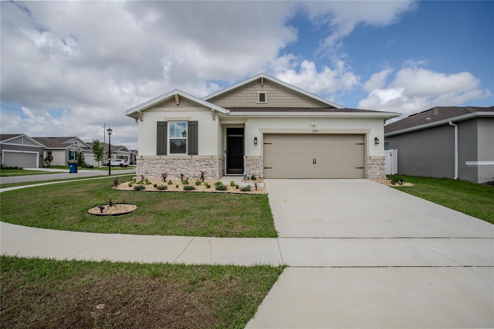 Welcome to this beautifully upgraded 2024 Richmond American Ruby model in sought-after Sutton Preserve! This 4-bedroom, 2-bath home offers nearly 1,900 sq ft of open-concept living with quartz countertops, solid wood cabinetry, tile flooring throughout the main areas, and carpet in the bedrooms. The spacious kitchen features a large island, pantry, and stainless steel appliances, flowing seamlessly into the living and dining spaces. Enjoy premium upgrades including epoxy garage floors, rain gutters, security cameras that convey, and assumable leased solar panels with a transferable 25-year warranty, offering energy efficiency and average electric bills under $20/month. Relax year-round in the enclosed screened patio with added shades and a fully fenced backyard for privacy. Conveniently located near shopping, dining, schools, and major roadways with low HOA and no CDD—this move-in ready home is a must-see!