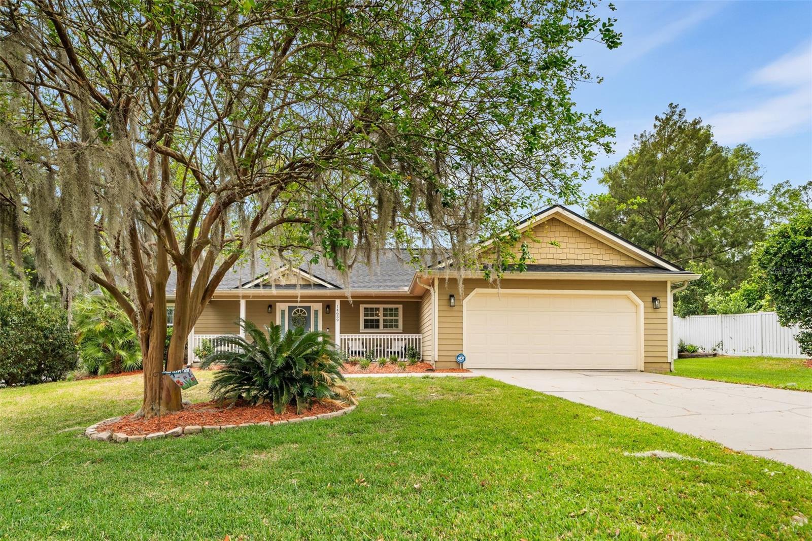 Welcome home to the beautiful neighborhood of Santa Fe Station just minutes away from downtown Alachua and a short commute to Gainesville or Lake City. Standing at the end of a shaded cul-de-sac, this stunning three bedroom two bathroom home offers both functionality and convenience. Entering the home, the foyer greets you with vaulted ceilings drenched in natural light and a floor plan ideal for family and entertaining. The kitchen features solid wood cabinetry and stainless steel appliances. The living room is very spacious, and French doors lead you to a large patio perfect for summer evenings in your private fenced yard. The primary suite is a relaxing retreat with an oversized walk-in closet and a large bathroom with dual vanities, a tiled shower and a spa like soaking tub. The split floor plan includes two additional generous bedrooms with a shared bathroom. You can never have too much storage, and you’ll find it with built in shelving in the laundry room. Recent updates include a new roof in 2024, and the home has recently been refreshed with exterior paint and landscaping. Don’t miss out on this beautiful home in one of Alachua's most sought after neighborhoods. Call today for a private tour!