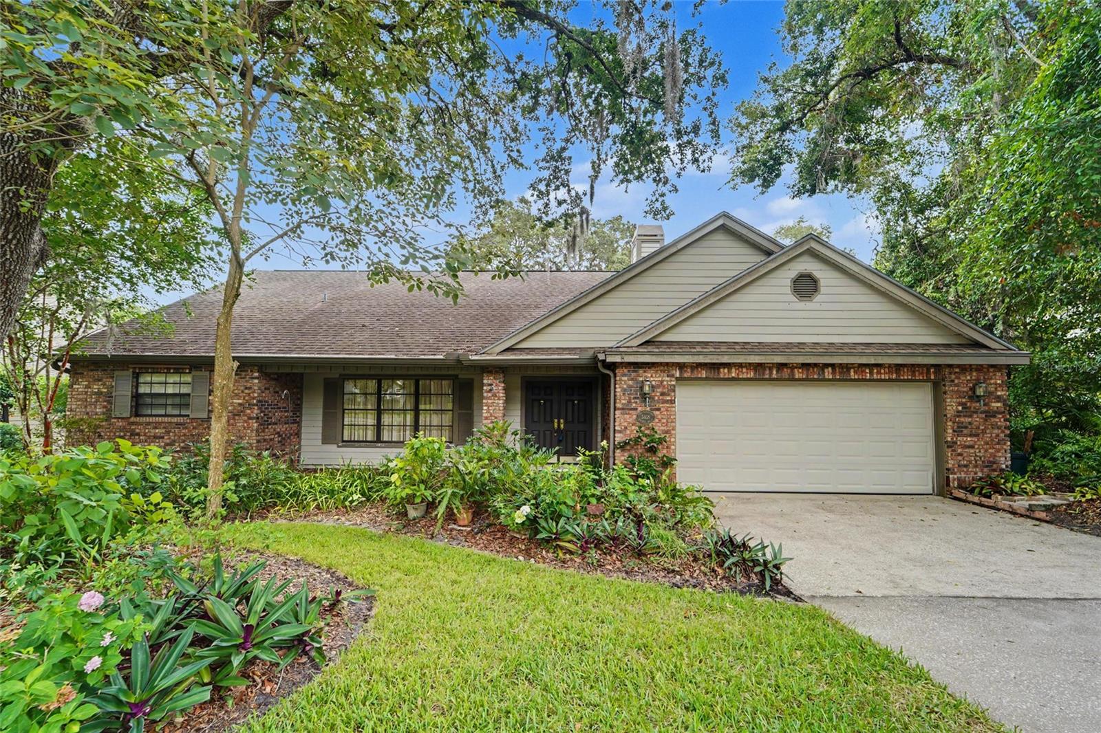 Welcome home to this 1869 sq ft, 3 Bedroom, 2-Bath SINGLE LEVEL SPLIT PLAN Residence, set on a peaceful conservation lot in a sought -after neighborhood. The screened BIRDCAGE POOL is one of the first refreshing highlights, offering a private retreat with serene CONSERVATION VIEWS. A charming and welcoming covered, brick front porch invites you in, where HARDWOOD FLOORS and SOARING VAULTED CEILINGS set the tone throughout the living room and dining room. The kitchen opens to the family room, where a cozy fireplace and Vaulted Ceilings create a welcome space where the family can congregate. The split-bedroom layout ensures privacy, with the primary suite featuring vaulted ceilings, FRENCH DOORS to the pool, an ensuite bath with a garden tub and separate shower, a private water closet, and a walk-in closet.   The attached two-car garage enters directly into the inside laundry room for convenience. If needed, Clear Hurricane Shutters allow natural light to shine through. AC is 2018. The price reflects the need for a new roof, as it was installed in 2005.  This home is located in a NON-FLOOD Zone, offering peace of mind. Outside, the covered lanai looks over the birdcage pool and the tranquil conservation area.  A small annual HOA fee of $507 covers the PICKLEBALL/TENNIS COURTS, PLAYGROUND, and COMMUNITY POOL. Located in an excellent school zone, you'll have easy access to shopping, dining, Gulf Beaches, and 2 International Airports. 
   This home offers a great balance of comfort, privacy, and convenience and is just waiting for you to make it your own.