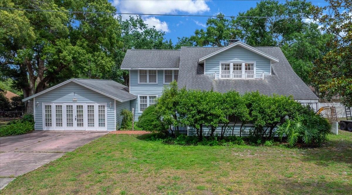 Step back in time and fall in love with the timeless charm of this beautifully maintained 1926 historic home in Apopka, Florida. Nestled on a lushly landscaped lot, this unique 3-bedroom, 2-bathroom home offers nearly a century of character while providing the flexibility today's buyers desire.

From the moment you arrive, you'll be captivated by the inviting screened front porch, perfect for enjoying Florida mornings with coffee or relaxing evenings with friends. Inside, rich architectural details, a cozy wood-burning fireplace, and spacious living areas create a warm and welcoming atmosphere that is increasingly difficult to find in newer construction.

The primary bedroom welcomes you with a large sitting room and closet space perfect for getting ready, relaxing, or extending the existing closet space!  

The heart of the home features a large open kitchen with abundant cabinetry and workspace, flowing seamlessly into the formal dining room, making it ideal for entertaining family and guests. A full bathroom downstairs adds convenience and functionality for multi-generational living or visiting guests.

One of the property's most exciting features is the oversized enclosed garage/flex space with its own access to both the front and rear of the property. This versatile area presents endless possibilities as a:

Home office
Bonus room
Game room
Guest quarters
Home business space
Potential future mother-in-law suite (MIL suite)
Rental income opportunity

Outdoor living is equally impressive with a spacious wooden deck overlooking an above-ground swimming pool, creating the perfect setting for summer gatherings, backyard barbecues, and year-round Florida enjoyment. Mature landscaping surrounds the property, providing privacy, beauty, and a tranquil retreat atmosphere.

If you've been searching for a home with historic character, flexible living space, investment potential, large outdoor entertaining areas, and authentic Florida charm, this one-of-a-kind Apopka gem deserves a place at the top of your list.

Nature lovers will appreciate being minutes from some of Central Florida's most sought-after outdoor destinations, including:
Wekiwa Springs State Park – famous for crystal-clear springs, kayaking, hiking, biking, wildlife viewing, and swimming.
Kelly Park – home to the popular Rock Springs Run tubing and recreation area.
Lake Apopka Wildlife Drive – a favorite destination for birdwatching, biking, and experiencing "Old Florida."
Magnolia Park – offering lake access, playgrounds, picnic areas, walking trails, and waterfront recreation.

Shopping, dining, and everyday conveniences are nearby, including: Apopka Commons, Errol Plaza, Apopka Plaza

Commuters will appreciate easy access to SR-429, SR-414, Downtown Apopka, Downtown Orlando, Winter Garden, Maitland, and major Central Florida employment centers.