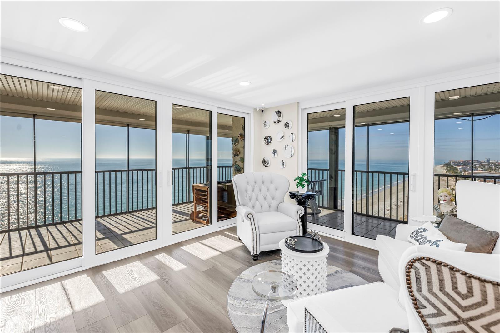 Perched atop the 10th floor, this exceptional penthouse has been masterfully reimagined with every detail perfected and no expense spared, offering a truly unparalleled beachfront lifestyle. Floor-to-ceiling impact-rated sliding doors showcase sweeping Gulf views from the kitchen, dining area, living room, and primary suite, seamlessly connecting to an expansive 60-foot wraparound balcony with new screening and electric hurricane shutters. The two guest bedrooms and the luminous, window-lined laundry room are graced with serene Intracoastal Waterway vistas, ensuring every space is infused with natural light and tranquility from sunrise to sunset. Every inch of this three-bedroom, two-bath residence speaks to refined design and uncompromising quality. Luxury plank flooring flows throughout, while the chef-inspired kitchen features quartz countertops, premium stainless-steel appliances, and custom cabinetry. Each bedroom is fitted with bespoke California Closets, and the primary suite offers direct balcony access and a spa-caliber en-suite bath with quartz counters and a glass-enclosed shower. The guest bath reflects the same elevated finishes. Behind the scenes, extensive upgrades include all new impact doors and windows, all-new plumbing and ductwork, a new relocated HVAC system optimized for comfort, a new electrical panel, wiring and lighting, and a new tankless water heater, combining technical perfection with aesthetic refinement. The penthouse lifestyle extends beyond the residence, with a curated suite of beachfront amenities including a heated pool and spa, convenient lounge and entertaining spaces, a beachfront fitness center, library, game room, whole-building water softener, secured lobby and under-building parking. Ideally situated in Madeira Beach, moments from premier dining, boutique shopping, and the iconic John's Pass Village, this penthouse also provides effortless access to Clearwater Beach, Downtown St. Petersburg, world-class sporting venues, and multiple international airports. This is a rare opportunity to acquire a residence crafted for discerning buyers who seek the pinnacle of luxury, comfort, convenience and coastal elegance.
