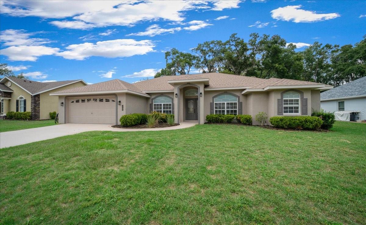 Welcome to Hidden Grove, one of Belleview's desirable gated communities offering privacy, convenience, and a low HOA of just $50 a month. This beautifully maintained 3-bedroom, 2-bath home with a versatile bonus room/den provides over 2,000 square feet of living space designed for comfortable everyday living and entertaining.

Step inside to discover a thoughtfully updated interior featuring spacious living areas and a flexible floor plan that can easily accommodate a home office, playroom, hobby room, or guest space. The split-bedroom layout offers privacy for family members and visitors alike. Enjoy the new quartz counter tops and appliances!!

Outside, your private backyard retreat awaits. Enjoy Florida living year-round in the sparkling kidney-shaped in-ground pool, complete with a solar heating system for extended seasonal enjoyment. The fully fenced yard offers plenty of space for a growing family, pets, gardening, or outdoor gatherings on the generous .26-acre lot.

Major updates provide peace of mind, including a newer HVAC system and a roof that is only three years old. Additional features include a 2-car garage, 2,061 square feet of living area, and 2,544 square feet under roof.

Perfect for growing families seeking more space or seniors looking for a move-in-ready home with room for guests and hobbies, this Hidden Grove gem combines comfort, value, and an exceptional lifestyle. Schedule your private showing today!