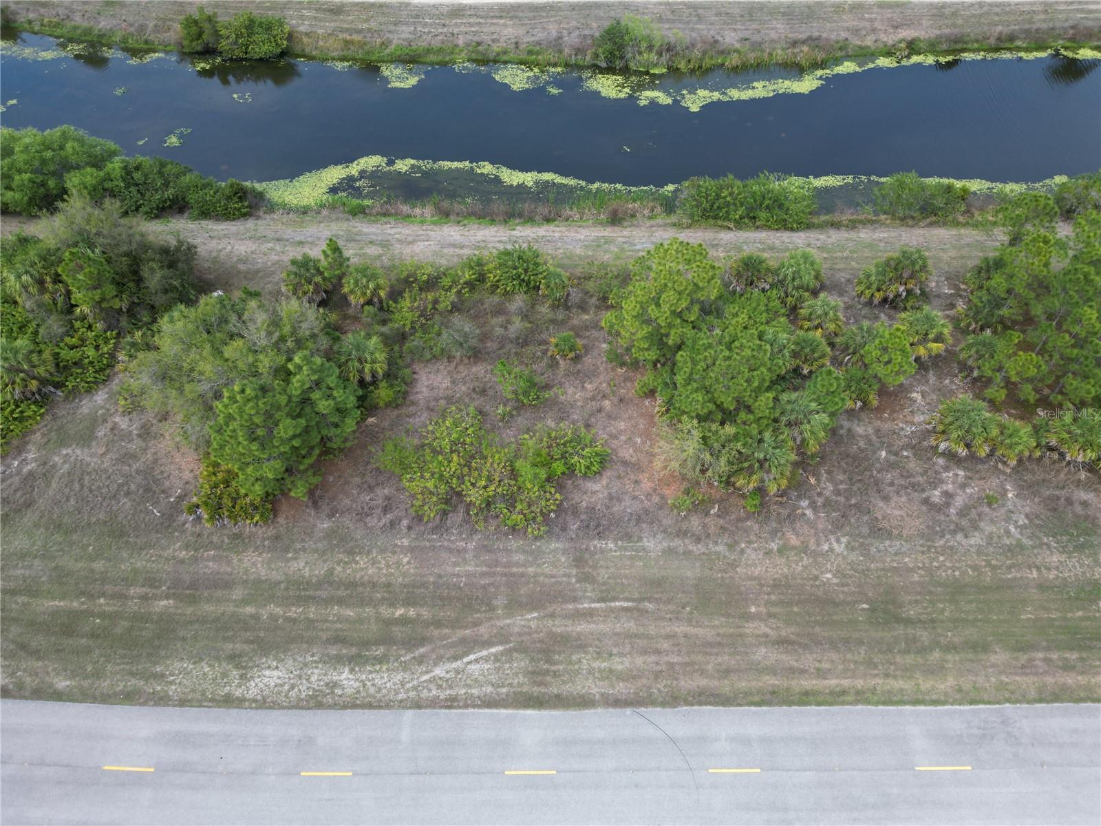 This WATERFRONT 0.27-acre vacant lot on Raintree Blvd offers a clean slate in one of Sarasota County’s fastest-growing cities. Located just minutes from I-75, the property provides easy access to Sarasota, Venice, Port Charlotte, and beyond—while still maintaining a quiet, residential feel. With no HOA and no deed restrictions, you have the freedom to design and build the home you actually want—whether that’s a primary residence, second home, or long-term investment. The surrounding area continues to see new construction, infrastructure growth, and expanding commercial development, making this a strategic location to buy and build. You’re also a short drive from Wellen Park, shopping, dining, parks, golf courses, and Gulf Coast beaches, offering both convenience and lifestyle appeal. For buyers looking to build, custom home-building guidance is available, including help navigating budgets, timelines, and design options. Whether you’re ready to build now or land-bank for the future, this lot delivers flexibility, location, and long-term upside.