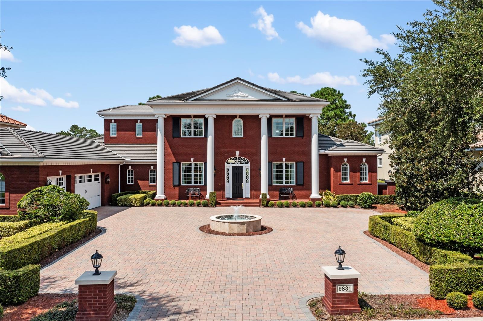Keene’s Pointe Beauty – Spectacular Custom Home located on one of the best lots on the 9th fairway of this Jack Nicklaus Signature Course with panoramic golf views, sunsets and water views to the front and back of this estate.  Classic Architecture with commanding presence on the outside and a bright, glamourous open concept on the inside. This estate exudes quality, attention to detail and an appreciation for upgrades and fine finishes of the current original owners. The exterior of the home is a solid layer of full-size brick, not veneer, over concrete block and wood frame.   You can see the 3–Car garage from the impressive circular drive, but you do not see the hidden golf cart garage on the back side which is outfitted like a golf simulator and locker room all in one! Private paver driveway provides direct access from the house to the golf course and the owners private covered cabana with fireplace where you can relax after your round! Now for the inside – Immaculate best describes the interior where you will marvel at the abundant natural light that captures prisms of color from the dazzling Waterford & Schonebeck crystal chandeliers that grace the 12 – 14 ft ceilings.   Transoms abound throughout the house accenting the light bright walls with wainscotting and built in cabinetry finished with marble countertops in the main living areas. Dark Brazilian cherry hardwood floors, in pristine condition, set off the light interior palette. The floor plan is open and exceptionally well designed; Primary and Guest Suite are on main floor along with an open study and dining room flanking the foyer entrance. The impressive formal living room opens to a magnificent saltwater pool 51’ x 31’ in size reflecting even more light into the home!  The, spacious kitchen with functional work spaces are so unique and practical! Elegant family room leads into Game room with deluxe bar, vaulted wood beamed ceiling, and stone wall with fireplace. Just steps away is the outdoor summer kitchen equipped with brand new 36” DCS grill, two beverage centers, two gas burners, remote screens and pass-through wet bar.  The “nirvana” of this outdoor living space continues with the enormous heated pool with oversized sun shelf & hot tub, which are embedded into a travertine deck and if you look carefully, you will note a cleverly designed half basketball court outlined by inlaid pavers.  Heading back into the house you will appreciate the welcoming primary suite, a sanctuary that consumes the entire north wing of the home, while the guest suite is on the opposite side of the house adjacent to the Game Room. On the second floor, you have 3 Ensuite Bedrooms - 2 with water views to the front of the home and the 3rd suite opens to a large private balcony overlooking the pool and golf course!  Life is good here!  Additionally, the upstairs residents have their own laundry facilities and a built-in desk in the common area.    In this more recently built Village of Grosvenor, the lots are all one-half acre or larger in size and there is a sense of peace that surrounds you. The homesite enjoys close proximity to Lake Tibet Butler, the second largest in Windermere’s famous “Butler Chain of Lakes” and provides a serene backdrop to this premium location.   Upgrades too numerous to list here can be found on the MLS attachments.   Owners have conducted a pre-inspection, and the home is impeccable! This property is a Treasure to be discovered!