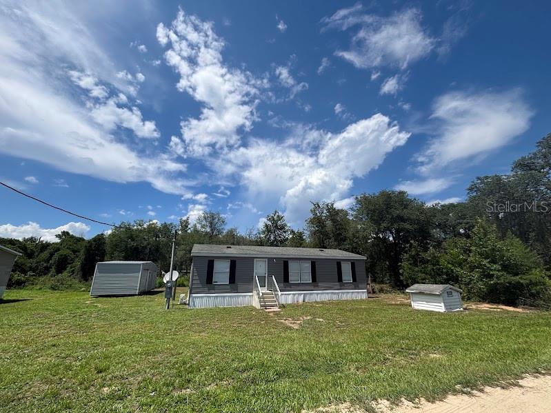 Manufactured Home in the Heart of the Ocala National Forest

Don't miss your opportunity to own your own piece of paradise!

This 1994 manufactured home offers 3 bedrooms and 2 full bathrooms in a peaceful, nature-filled setting that's perfect for full-time living, a weekend getaway, or a vacation retreat.

The property includes a large workshop/storage building with a roll-up door, making it ideal for storing ATVs, side-by-sides, boats, motorcycles, or other recreational equipment. A second storage shed provides additional space for tools, lawn equipment, or hobbies.

Conveniently located just minutes from Lake Ocklawaha and the Ocklawaha River, you'll enjoy endless opportunities for boating, kayaking, fishing, and exploring Florida's natural beauty.

Situated in the heart of the 383,000-acre Ocala National Forest, this property offers easy access to miles of hiking, horseback riding, wildlife viewing, and the Florida National Scenic Trail. You'll also be close to some of Florida's most popular outdoor destinations, including Lake Kerr and Lake George, two of the state's premier bass fishing lakes.

Despite its peaceful setting, you're only a short drive from Fort McCoy and Salt Springs, giving you convenient access to shopping, dining, and everyday necessities while still enjoying the tranquility of country living.

Whether you're looking for adventure, relaxation, or a place to create lasting memories, this property offers the perfect blend of comfort, storage, and outdoor recreation.

PROPERTY FEATURES
* 1994 Manufactured Home
* 3 Bedrooms
* 2 Full Bathrooms
* Large Detached Building with Roll-Up Door
* Additional Storage Shed
* Near Lake Ocklawaha & Ocklawaha River
* Minutes from Lake Kerr & Lake George
* Located within the Ocala National Forest
* Close to the Florida National Scenic Trail
* Easy drive to Fort McCoy and Salt Springs

Reconnect with nature and make this beautiful property your own!