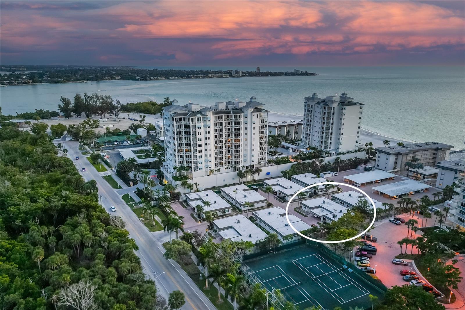 Virtually Staged. Situated on the serene southern tip of Lido Key within the coveted First Lido community, Villa 12 delivers a coastal living experience that is increasingly rare—blending the privacy of a single-family home with the effortless, maintenance-free lifestyle of a ground-level villa. With 2 bedrooms, 2 full baths, and a versatile enclosed Florida room, this residence is ideal for those seeking a quiet island retreat with the vibrant energy of Lido Key just moments away.

The villa has been significantly updated from the studs out, providing a fresh and clean interior canvas. The open-concept floor plan features porcelain tile flooring throughout and a modern kitchen appointed with brand-new appliances and sleek finishes—offering a bright, functional space for everyday living and hosting. While the core renovation work has been completed, the home remains a "living canvas," providing a unique opportunity for a new owner to add their own custom refinements and personal style to a high-potential space.

Practicality is built-in with rare amenities, including a private attached carport for door-front parking and a dedicated in-unit laundry room. The enclosed Florida room adds valuable square footage, serving as a flexible den, office, or guest space. Just steps from your door, enjoy private beach access and a gulf-front pool where residents gather for sunset views.

Positioned just minutes from St. Armand’s Circle and South Lido Park, the location is truly peerless. With a highly motivated seller ready to move, this property is priced to reflect its current condition and presents a significant opportunity for a buyer looking to secure a renovated Lido Key address at a competitive value. Whether you’re looking for a seasonal escape or a high-potential investment, Villa 12 offers a solid foundation in a premier beachside setting.