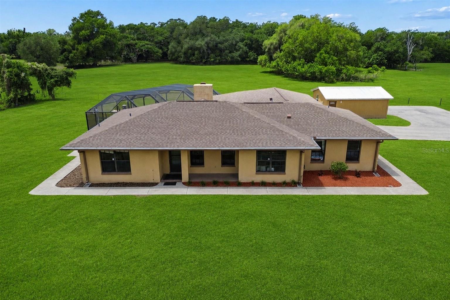 Welcome to your own private retreat, where country living meets everyday convenience on just under 1.25 acres. This 3 bedroom, 2 bath pool home offers a rare combination of space, flexibility, and functionality. The property features a detached in-law apartment complete with its own private bathroom, ideal for guests, multi-generational living, a home office, or additional income potential.
Inside, the home offers a warm and inviting layout highlighted by a cozy fireplace and comfortable living spaces designed for both everyday living and entertaining. Step outside to enjoy the pool, expansive outdoor space, and peaceful setting that provides privacy while still being conveniently located near shopping, dining, and major roadways. Additional highlights include a newly paved driveway, ample room for parking, and endless potential for those seeking a property with room to spread out and enjoy the Florida lifestyle.