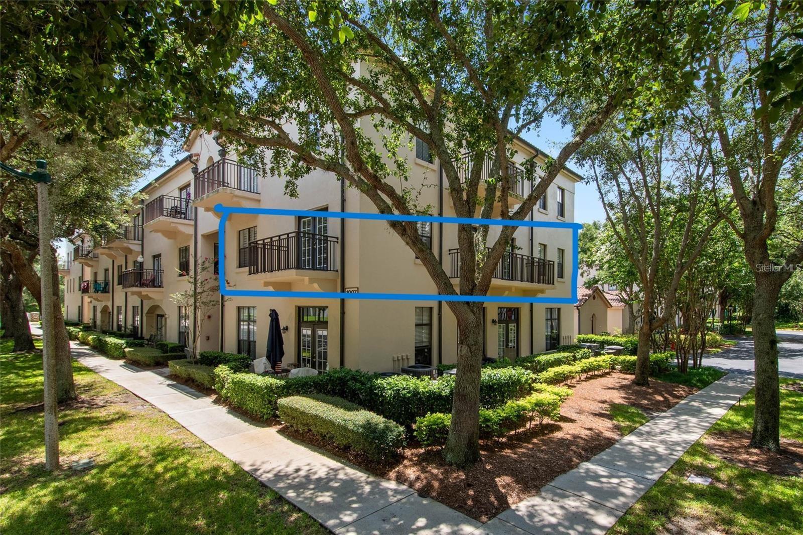 LOOKING FOR LOW CONDO FEES? Look no further as this unit has One of the Lowest Dues in Celebration! NEW A/C INSTALLED IN JUNE 2026.This Concrete Block Condo is Spacious and Clean and as a corner unit has no adjoining walls with other residences so enjoy quiet living on the second floor in an ELEVATOR building. This 3 bedroom 2 bath condo has a split floor plan and offers two large balconies, one off the living/dining room that is somewhat weather protected by the balcony above and the other one is off the 3rd bedroom, both looking out over a pond! Plantation shutters throughout enhance the large windows making this a very bright inviting unit. The entire condo was freshly painted and Luxury Vinyl Flooring was installed in two of the bedrooms in January 2025, whereas ceramic tile flooring can be found in all the remaining living spaces. Stainless appliances, Granite on the Island and Corian Counter tops finish off the wood cabinets in the kitchen. NEW A/C INSTALLED ON JUNE 10TH 2026. There's a linen closet in each bathroom, a coat closet at the entry door and a large walk in closet in the Owner's Suite. The laundry room offers additional storage space besides the exterior storage unit that is adjacent to the assigned carport. Location is excellent, being a short distance to downtown where all the fun events take place in Celebration. 30 minutes to the Orlando International Airport, all the Theme Parks, Casual and Fine dining and several shopping centers that are sure to suit everyone's budget. Call today for your showing and make this lovely condo your new Florida Home!