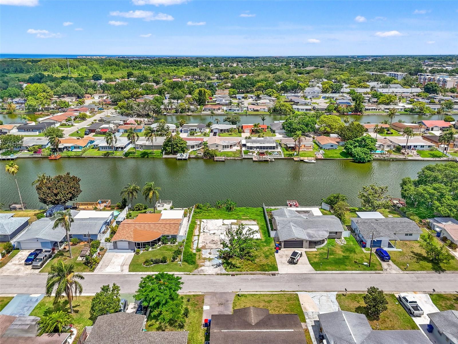 Rare opportunity to build your dream home on this waterfront lot, situated on a peaceful canal with breathtaking views. With no HOA, you’ll enjoy the freedom to design and build the home that perfectly fits your lifestyle. Boating, fishing, kayaking, sunbathing, the possibilities are plentiful. Conveniently located with easy access to US-19, this property is just minutes from Tarpon Springs Sponge Docks, Fred Howard Park, Anclote River Park, as well as a variety of popular restaurants, shopping, and everyday conveniences. Whether you’re looking to create a full-time residence, seasonal retreat, or investment property, this waterfront lot offers a unique opportunity to enjoy the beauty and tranquility of Florida living. Don’t miss this chance to build and create the waterfront lifestyle you’ve always been dreaming of.
