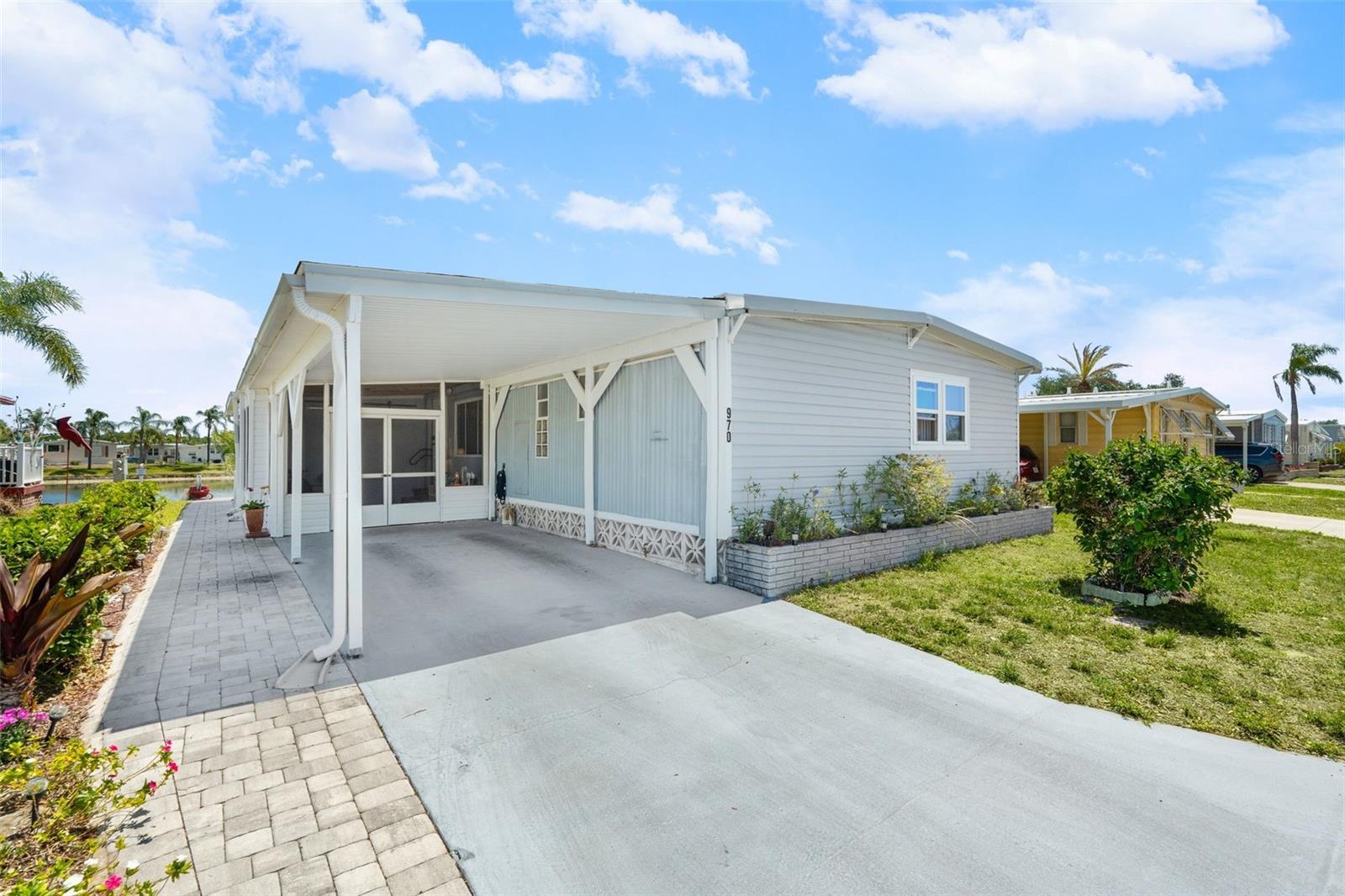 Welcome to waterfront living in the sought-after Venice Isle community! This well-maintained 2-bedroom, 2-bath home features an open-concept layout filled with natural light and modern touches throughout, creating a bright and inviting atmosphere.

Enjoy peaceful lake views from the expansive covered, screened lanai—perfect for catching the breeze and relaxing any time of day. The home also includes an updated second bathroom and is being sold turnkey for added convenience.

Located in a resident-owned 55+ community, Venice Isle offers resort-style amenities including clubhouses, heated pools, fitness center, tennis, and a vibrant social scene—all just minutes from beaches, shopping, and dining.