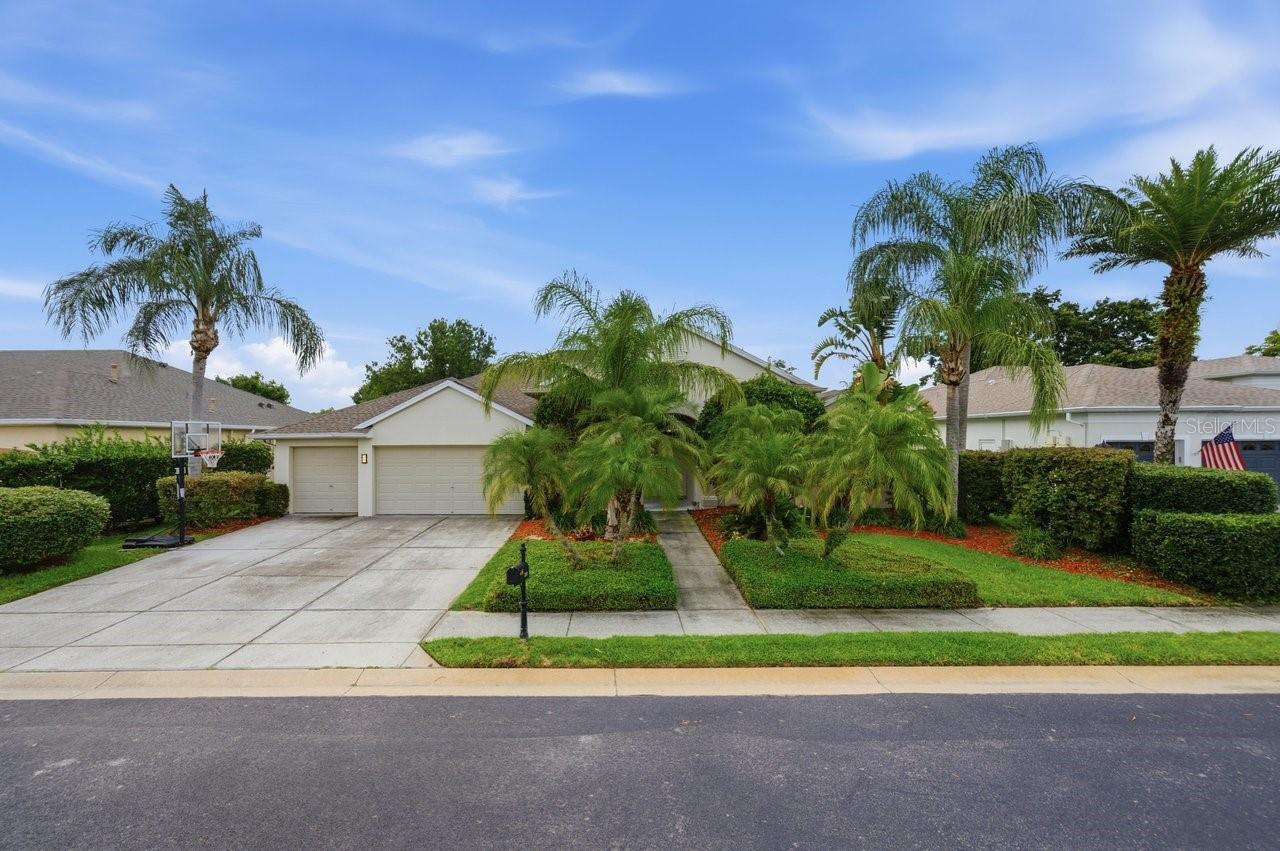 Welcome to this incredible Fox Wood home, tucked in the back of the larger impeccably maintained and manicured Cameron's Point community located in the heart of Trinity. This prestigious gated community is within the desirable local school districts of Pasco! As you approach this imposing 5 bed, 3 bath, 3 car garage, pool home you will immediately appreciate the freshly manicured front yard which invites you to the impressive grand front entrance, there is even a shady area to enjoy the beautifully landscaped front garden! The grand, arched double door entrance invites you into the foyer, offering the impressive formal living area which includes many architectural details that overlooks the pool area. To the left of the entrance there is a glass block half wall with the spacious dining room featuring a detailed double tray ceiling facing the front of the house, yet it's only steps away from the formal living room, a perfect space for large gatherings! The flex room which is currently used as a home office is conveniently off the formal living area and yet it is located close to the primary suite. As you enter this beautiful suite which runs from the front to the back of the house, you will love the high ceiling with a double tray feature, the built-in shelving nook and the private access to the pool area and expansive walk in closet!
As you walk into the formal living room which boosts breathtaking views of the covered lanai and birdcaged pool area beyond. The expansive kitchen is truly the heart of this home! With stainless steel appliances, a convenient oversized island, a separate pantry, it's a chef's delight and the perfect place to entertain while overlooking the bright family room with a dramatic fireplace as the focal point.There is another area which could be used as an additional dining area right beside this living space where you can enjoy beautiful views of the pool. The laundry room is conveniently located just off the kitchen. There is a further two way split plan with two bedrooms and bathrooms, one of which serves as a pool bath, it makes for easy living at its very best! The second story bonus room/ bedroom would make the perfect gym, arcade room or a flex room for gaming; or for some it could be a fantastic man cave! The sparkling birdcaged pool is the crowning glory for this wonderful home so don't delay in seeing it before it's gone!