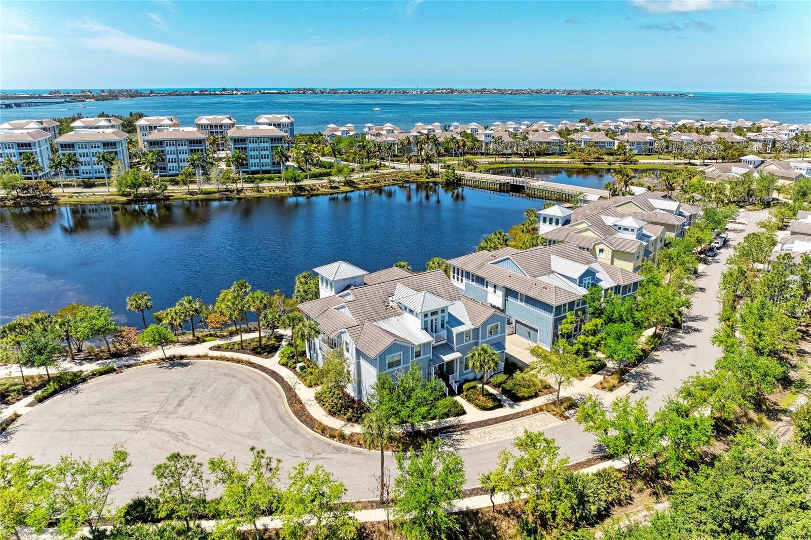 Welcome to refined coastal living in the highly sought-after Abaco floorplan within the Harbour Isle community—where luxury, lifestyle, and effortless elegance converge. This impeccably maintained 3-bedroom, 3-bath residence, complete with a sunroom and a versatile office that easily serves as a fourth bedroom, offers a rare opportunity to experience resort-style living paired with the comfort and sophistication of a meticulously upgraded home.

From the moment you step inside, sparkling water views over Sapphire Lake create a serene and captivating backdrop. Perfectly positioned as a private end unit at the edge of the community, the home offers an exceptional sense of privacy—with no visible neighbors and sweeping views of the lake and the lush expanses of Perico and Robinson Preserve just beyond your windows.

Pride of ownership is evident in every detail. Thoughtfully enhanced and beautifully maintained, the home reflects a seamless blend of modern convenience and timeless design. Refined updates include low-VOC interior paint, upgraded tile flooring in the guest suites, a beautifully reimagined kitchen, elegant lighting, and a professionally finished epoxy garage floor. Additional enhancements such as a newer HVAC system, whole-house and kitchen water filtration, an updated alarm system, and refreshed fixtures further elevate the living experience. Smart home features—including a Ring entry system, remote thermostat, and an advanced detergent-free laundry system—bring ease and efficiency to everyday living, while updated appliances ensure both style and functionality throughout.

Beyond the residence, Harbour Isle delivers an unparalleled coastal lifestyle. Residents enjoy exclusive access to a private beach club overlooking Anna Maria Sound, featuring a resort-style pool, fitness center, Sky Bar, and scenic walking trails. Kayaking, paddleboarding, and sunset watching become part of your daily rhythm, while the gated community offers both peace of mind and a vibrant social atmosphere. An on-site marina provides direct access to the Gulf, inviting effortless days spent on the water.

Ideally located just minutes from the sugar-white sands of Anna Maria Island, this home places you at the center of Florida’s most treasured coastal destinations. Explore charming boutiques, waterfront dining, and cultural attractions in nearby Bradenton and Sarasota, or enjoy easy access to biking and hiking through Robinson, Perico, and Neal Preserves, along with boating, golf, and world-class beaches.

This is more than a home—it’s a lifestyle defined by comfort, quality, and coastal sophistication. Schedule your private showing and begin living a life you don’t need a vacation from, today!.