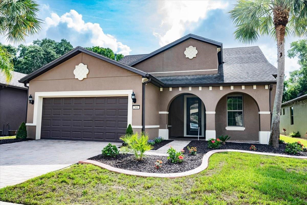 Located in the sought-after Del Webb Orlando 55+ community, this beautifully maintained home offers the perfect combination of space, comfort, and an active Florida lifestyle. Just a short walk from the clubhouse and community pool, you'll enjoy easy access to the impressive amenities that make Del Webb Orlando one of Central Florida's premier adult communities. Inside, soaring ceilings, upgraded interior doors, rounded drywall corners, and beautiful tile flooring throughout the main living areas create an inviting first impression. The thoughtfully designed floor plan offers 3 bedrooms, 3 bathrooms, a private office, and plenty of space for both everyday living and entertaining.
The heart of the home is the spacious kitchen, which opens seamlessly to the dining area and great room. Featuring granite countertops, 42-inch wood cabinetry, a gas range, a large island with seating, a walk-in pantry, and a separate butler's pantry with a beverage refrigerator and wine storage, it's easy to imagine gathering with family and friends here. The first-floor primary suite provides a comfortable retreat with a spacious, custom walk-in closet and private bath. Upstairs, guests will appreciate having a space of their own with a private bedroom, full bathroom, loft living area, and abundant storage. Whether hosting visiting family, grandchildren, or long-term guests, the layout offers both convenience and privacy. Step outside to the screened lanai, where there's plenty of room for outdoor dining, relaxing, or simply enjoying Florida's beautiful weather. Fresh landscaping and new sod add to the home's curb appeal, while the oversized tandem garage accommodates up to three vehicles and offers additional storage space. Two HVAC systems, both less than five years old, provide added peace of mind. Beyond the home itself, Del Webb Orlando offers an exceptional lifestyle with a clubhouse and tavern serving beer, wine and bar food, fitness center, indoor and outdoor pools, pickleball and tennis courts, billiards, ping pong, and a full calendar of social activities. Within the community of Ridgewood Lakes, just outside of the Del Webb entrance, there is also a championship golf course and the entire neighborhood is “golf cart friendly”.  Surrounded by scenic lakes and natural beauty, yet conveniently located near shopping, restaurants, medical facilities, and Central Florida attractions, this home offers the lifestyle you've been waiting for.
