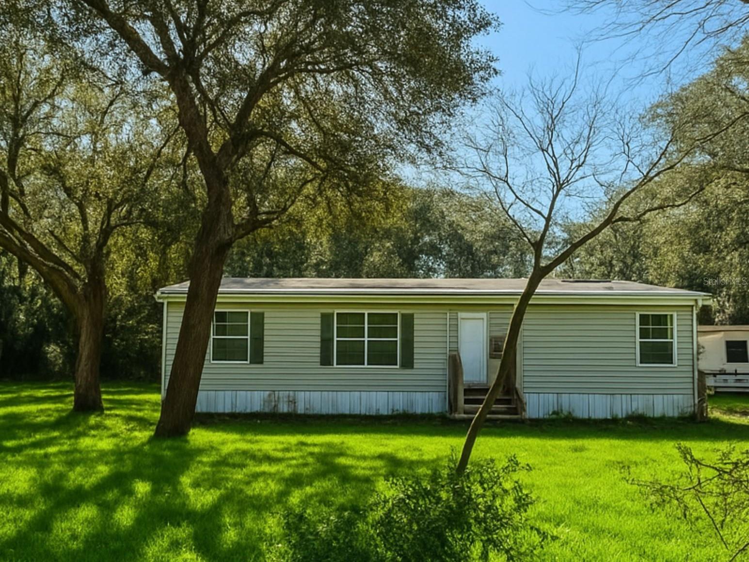 Your Private Sanctuary Awaits!

Nestled on 0.52 acres of cleared, fully fenced land and surrounded by tranquil woods, this beautifully updated 3-bedroom, 2-bathroom home offers the perfect balance of privacy and convenience. Located in a quiet neighborhood, you'll enjoy a peaceful setting while being just minutes from local shops and close to the river for outdoor recreation. Step inside to a Brand-new flooring throughout, creating a bright, modern, move-in-ready atmosphere. The open concept living and dining areas are filled with natural light, making them ideal for both everyday living and entertaining. The primary suite is a true retreat, featuring an en-suite bathroom with a large jacuzzi tub, perfect for relaxing after a long day. Two additional bedrooms provide flexible space for guests, family, or a home office. Major updates completed in 2024 include a brand-new roof, new water heater, and a new motor for the AC unit, offering peace of mind and long-term value. The kitchen is practical and functional, with newer appliances, ample storage and workspace, and all appliances convey with the home. A small metal shed is also included for extra storage. Outside, enjoy the fully fenced yard, ideal for pets, gardening, entertaining, or simply relaxing in your own private oasis. The property features mature trees and natural landscaping, including a lime tree, blueberry bush, thornless blackberry bush, magnolia tree, and more. This home is a rare find offering space, privacy, modern updates, and natural beauty. Schedule your showing today!
