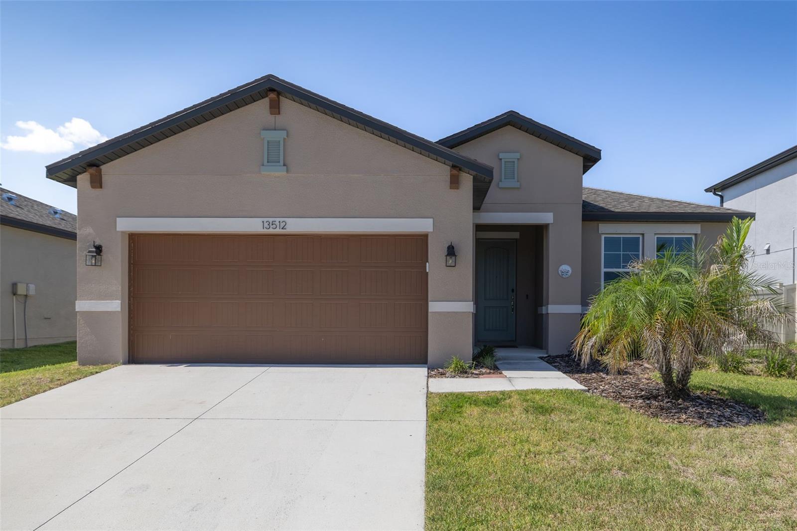 Welcome to this beautifully maintained 4-bedroom, 2-bathroom home offering nearly 1,900 square feet of thoughtfully designed living space and a spacious 2-car garage. From the moment you step inside, you’ll appreciate the open layout, stylish finishes, and numerous upgrades throughout. The heart of the home is the stunning kitchen, featuring wood cabinetry, a gray subway tile backsplash, quartz countertops (quartz countertops throughout the home), stainless steel appliances, and a decorative center island perfect for entertaining or everyday living. The spacious living room is enhanced with laminate plank flooring, pre-wired surround sound, prewired ceiling fans (bedroom and living room wired with separate switches), and a convenient floor outlet for flexible furniture placement. The private owner’s suite offers a beautiful wood accent wall, large walk-in closet, and an upgraded bathroom with a walk-in shower and upgraded comfort-height toilets (both bathrooms). The additional bedrooms are generously sized, including a versatile front bedroom complete with built-in shelving, desk, and Murphy bed—ideal for a home office, guest room, or flex space. Additional features include laminate flooring throughout the main living areas and front bedroom, 3 carpeted bedrooms, large walk-in closets, Ethernet wiring throughout the home, an Ecobee WiFi-enabled smart thermostat, doorbell camera, hurricane shutters, 
motion-activated flood lights on both sides of the home, and a dedicated 20-amp outlet in the garage. Step outside to enjoy the fully fenced backyard, providing privacy and plenty of space for pets, play, or outdoor gatherings. Backyard is big enough to BUILD YOUR OWN DREAM POOL! This move-in-ready home combines modern convenience, smart-home technology, and stylish design—all in one exceptional package. Nestled in a convenient location to US Highway 301 and Interstate 75, downtown Tampa, MacDill Air Force Base, and Tampa International Airport. With nearby shopping, dining, and Great schools. AICE program and Dual enrollment offered at Sumner High School. Within the community, you'll find an array of amenities to enhance your lifestyle: a community pool, splash pad, dog park, playground, walking trails with fitness stations, and basketball courts. There are endless opportunities for outdoor activities and recreation at The Reserve at Pradera. Come Enjoy all the AMAZING amenities. Schedule your showing today!! NO Flood Zone! LOW ANNUAL HOA and CDD is in the TAXES.