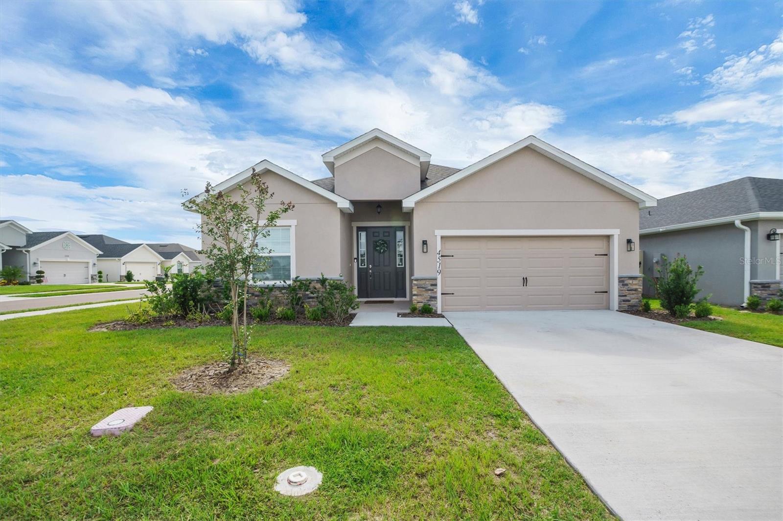 Welcome home to this beautifully designed 4-bedroom, 2.5-bath residence nestled on a desirable corner lot in the heart of Central Florida! From the moment you step inside, you’ll love the bright and open feel, complemented by stylish luxury vinyl plank flooring throughout the main living areas. The spacious kitchen is truly the heart of the home, featuring a large center island perfect for entertaining, meal prep, or gathering with family and friends, along with an oversized walk-in pantry offering an incredible amount of storage. The open-concept layout flows seamlessly into the living and dining spaces, creating an inviting atmosphere for both everyday living and hosting guests. Designed with functionality in mind, this home features a convenient guest half bath, while the secondary bedrooms are connected by a thoughtfully designed Jack-and-Jill bathroom layout. Step outside to enjoy the covered lanai and partially fenced backyard, creating a private space to relax and enjoy Florida living. The corner lot adds extra curb appeal and a welcoming presence within the community. Located in a sought-after community with a resort-style pool and fantastic amenities, this home combines comfort, style, and convenience all in one. With easy access to shopping, dining, attractions, and everything Central Florida has to offer, this one checks all the boxes!