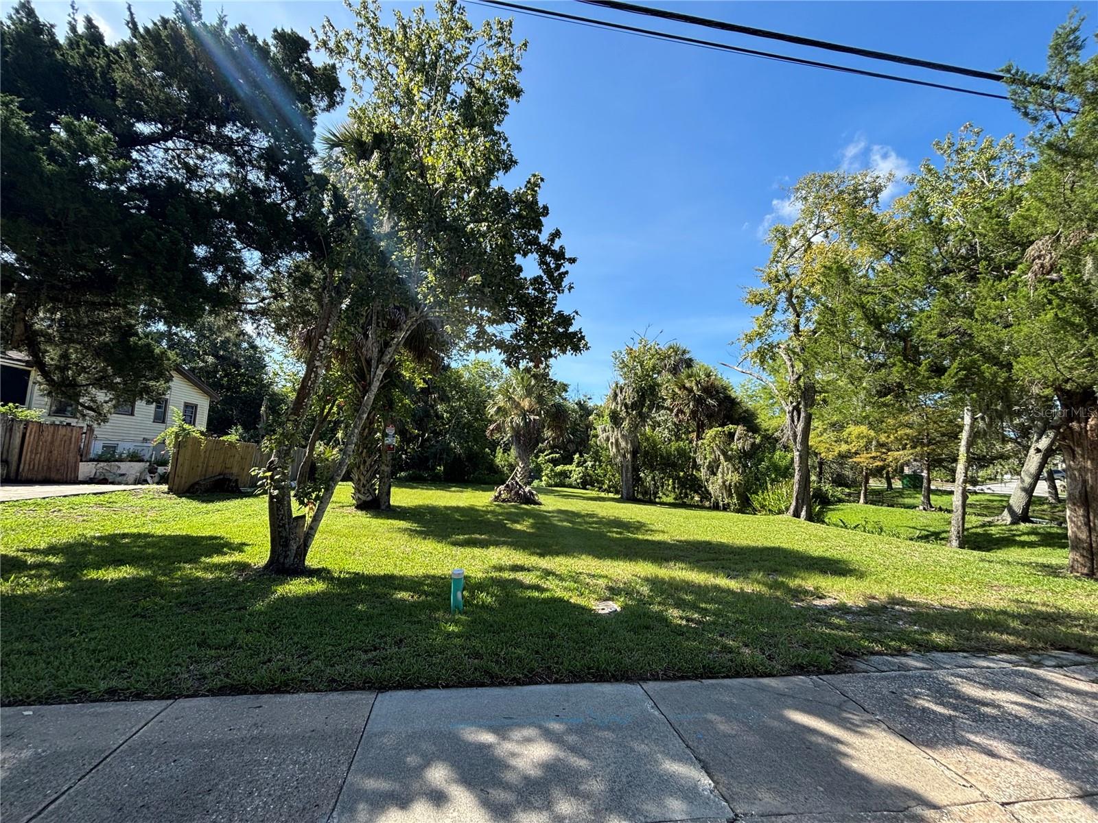One or more photo(s) has been virtually staged. Lovely lot walking distance from Riverwalk Park, restaurants, and public transportation. Electric, water, and sewer available. Lot is buildable, but buyer needs to check county/city codes for type of dwelling that can be built on the property.