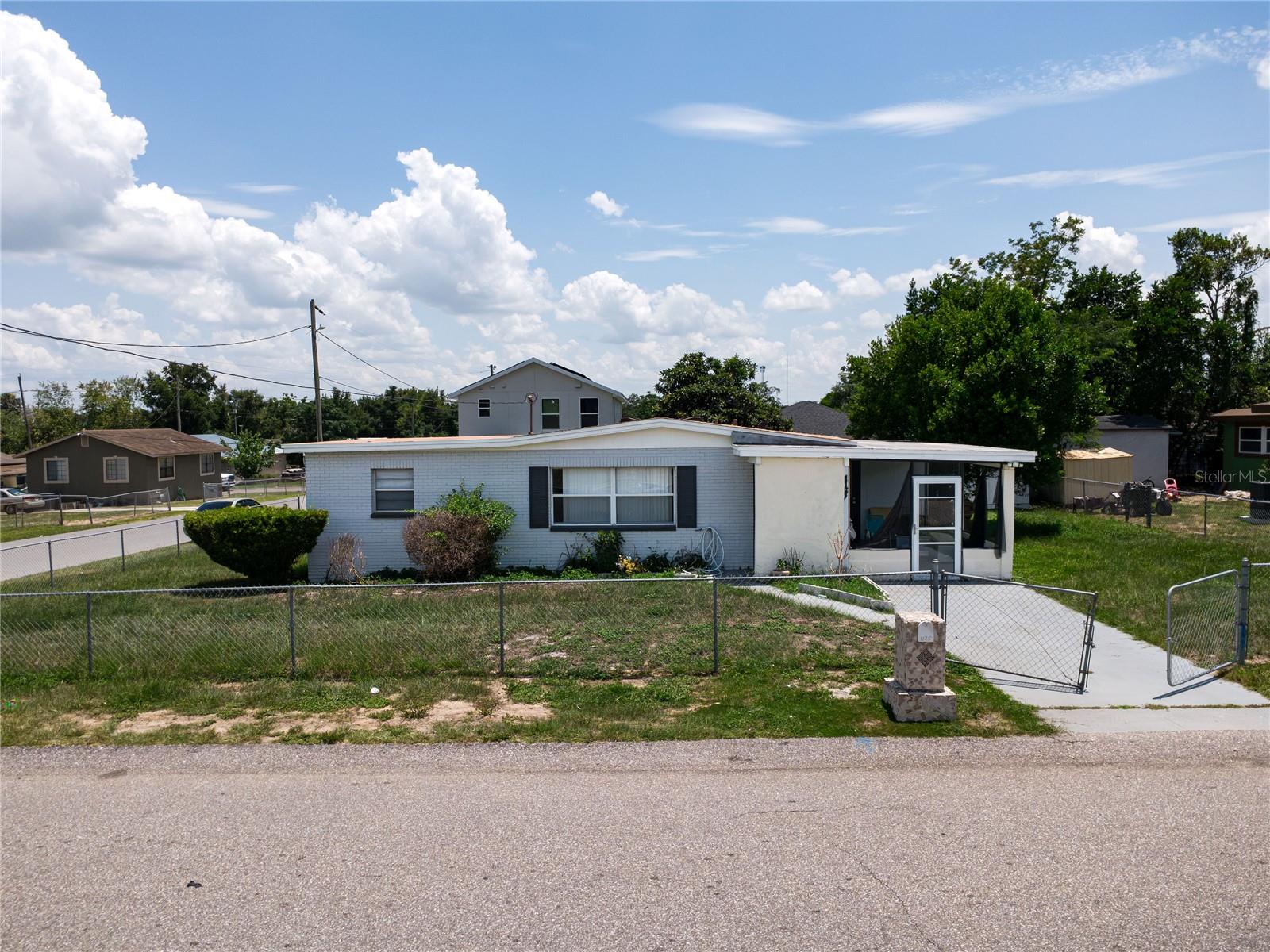 COMPLETELY REIMAGINED & ABSOLUTELY STUNNING! 2024 TOTAL RENOVATION! Attention Homebuyers and Savvy Investors! This is the TURN-KEY OPPORTUNITY you have been waiting for! Nestled on a generous 0.23-acre corner lot in the booming heart of Haines City, this solid concrete block powerhouse was completely overhauled in 2024. Everything inside is BRAND NEW, giving you that flawless "New Construction Feel" without the new construction wait or price tag!
STEP INSIDE AND FALL IN LOVE:
Expect to be wowed by a bright, sun-drenched open-concept layout flowing over gorgeous, low-maintenance luxury vinyl plank flooring—absolutely NO carpet! The breathtaking chef’s kitchen is a showstopper, boasting solid wood cabinets, sleek premium quartz countertops, and brand-new stainless steel appliances. The layout has been masterfully optimized to feature a spacious primary suite and a total of 2 fully upgraded, custom-tiled bathrooms. Plus, the massive, fully finished 13' x 23' Florida Room/Sunroom offers the ultimate flexibility—easily use it as a 4th bedroom, a high-end home office, or a media room! PREMIUM EXTRAS & PEACE OF MIND:
 Big-Ticket Items Done: The Roof and Central A/C system are both highly efficient and under 5 years old!
 Zero Hassle: Connected to public water and public sewer (No septic tanks to worry about!).
 Storage & Parking: Convenient 2-car attached carport plus a detached storage shed in the backyard.
 Investor Dream: No HOA or CDD fees! Total freedom to rent or park your recreational vehicles/boats! UNBEATABLE COMMUTER LOCATION & ROAD ACCESS:
Getting anywhere is an absolute breeze! This property boasts unmatched connectivity to Central Florida’s most vital transportation veins:
 Immediate Access: Just seconds away from US-17/92 and US-27, making local commuting effortless.
 Minutes to I-4: Jump onto Interstate 4 (I-4) in less than 10 minutes for a direct, high-speed shot straight into Downtown Orlando or Tampa.
 Easy Routes: Smooth connection to the Polk Parkway (SR-570) for quick travel across Polk County and Lakeland, and close proximity to Cypress Gardens Boulevard. LIFESTYLE & ENTERTAINMENT AT YOUR DOORSTEP:
You are surrounded by convenience! Top-rated local schools, Polk State College, major supermarkets (Publix, Walmart Supercenter), and vibrant dining options are just around the corner. And when it's time for fun, you are perfectly positioned right in the center of world-class entertainment: Legoland Florida: A quick, scenic 15-minute drive!
 Walt Disney World Resort: Under 30 minutes away via I-4 or US-27!
 Universal Orlando & SeaWorld: Fast, straight-line access for weekend adventures!
This home is priced to sell, beautifully updated, and perfectly located to capture maximum market demand. Do not wait—this absolute gem will NOT last. Schedule your private tour today and make it yours before someone else does!