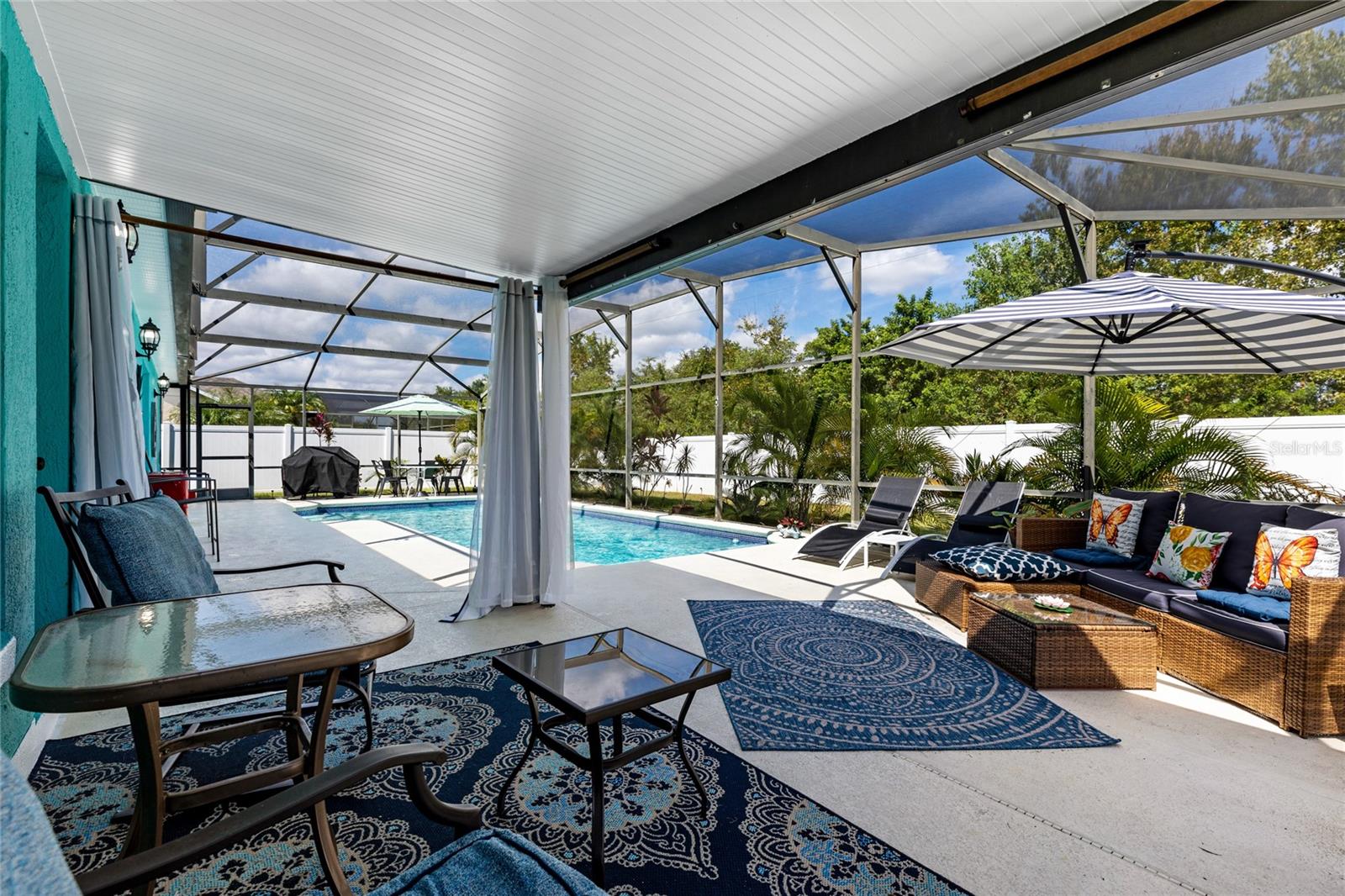 Indulge in the allure of this captivating 3-bedroom, 2-bathroom haven situated in the sought-after community of Crescent Lakes. The kitchen is a culinary masterpiece, featuring remodeled aesthetics with modern appliances, granite countertops, and an open concept design. The bathrooms were meticulously recently remodeled, and the pool, a focal point of luxury, was recently resurfaced, and a new roof installed in 2019.
Immerse yourself in the welcoming Living Room featuring vaulted ceilings, providing an inviting atmosphere. The sliding door access opens to pool deck, enhancing the connection between indoor and outdoor living. The owner's suite offers a tranquil retreat with a walk-in closet and a tastefully designed en-suite bathroom. The second and third bedrooms share access to the remodeled second bathroom, with a convenient outside entry directly to the pool deck.
Speaking of the outdoors, the enormous fenced in backyard not only provides ample space but also hosts a screened-in pool, creating a private oasis perfect for relaxation and entertaining. This property is a potential investment gem as it is conveniently zoned for short-term rentals. Located in proximity to Disney, Orlando Resort, hospitals, and major highways, this home marries convenience with luxury. With its 3 bedrooms, 2 bathrooms, and a total square footage of 1450, 5310 Harmony Pl invites you to experience the epitome of modern living. Act now and schedule a private viewing to make this your dream home.