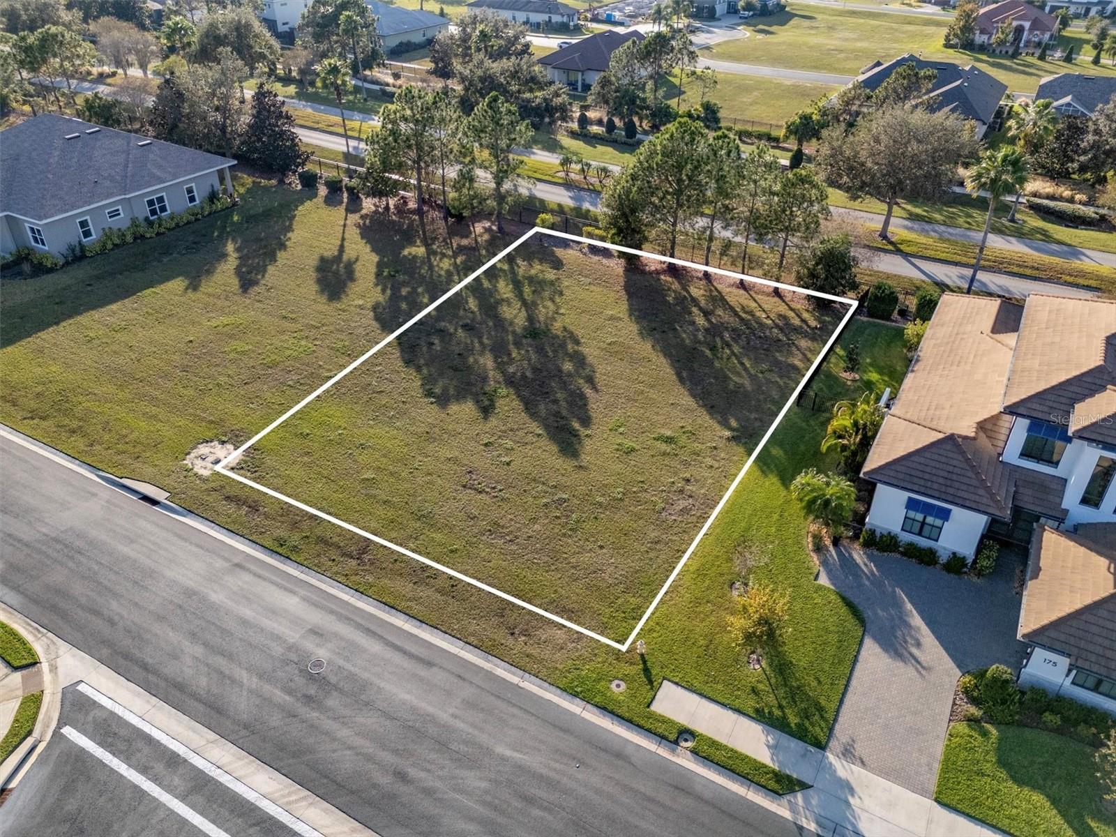 Build your dream home with elevated lake views in the gated waterfront community of Water Ridge. This spacious, level homesite at 171 Blazing Star is positioned at one of the highest elevations in the neighborhood, offering breathtaking views of Lake Alfred & the surrounding countryside,  a rare combination of privacy, scenery, & topography in Central Florida. Water Ridge is an award-winning Polk County Parade of Homes community surrounded by three lakes, including Lake Alfred, Lake Van & Lake Medora, and is designed for true resort-style living with three community pools, a luxury clubhouse, fitness center, tennis & pickleball courts, playground, boat ramps, fishing docks, lake access, boat storage, and underground utilities that enhance the clean, upscale feel of the community. Bring your own builder and plans to create a fully custom home tailored to your vision, with the added benefit of being just a short distance from the pool, cabana, playground, and sports courts. Outside the gates, you are minutes from Publix at Lake Alfred, Auburndale’s growing shopping & dining corridor, Grove Roots Brewing Co., The Barn Antiques, Mackay Gardens & Lakeside Preserve, Lake Myrtle Sports Complex & Florida Polytechnic University. With quick access to I-4, commuting to Tampa or Orlando is convenient, and major attractions such as Walt Disney World and Universal Studios Florida are within easy reach, all while enjoying the peace and security of a private lakefront community. Seller is offering owner financing, creating a unique opportunity for buyers seeking flexibility. Secure your place in Water Ridge and start building the lifestyle you’ve been waiting for.