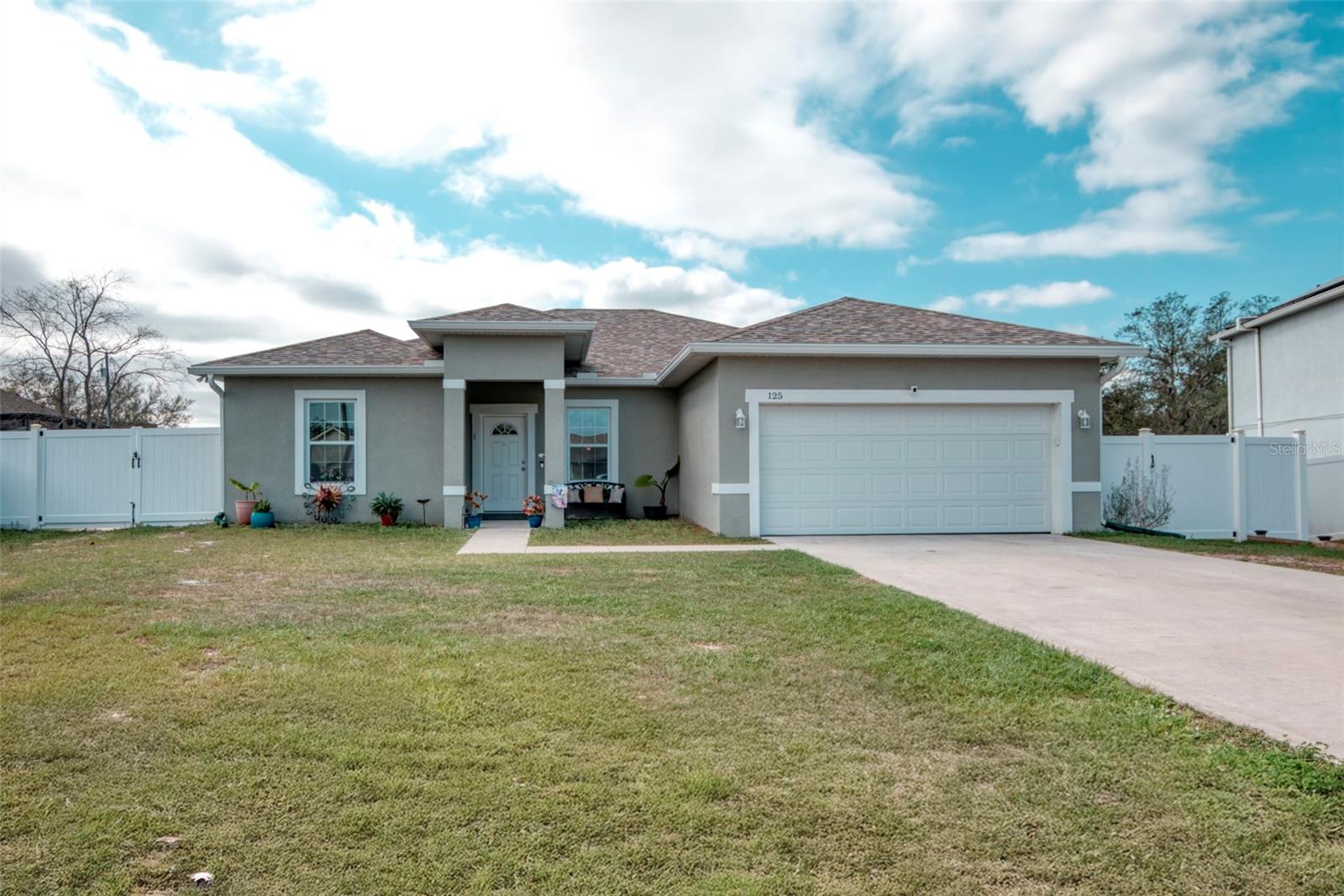 Welcome to your spacious single-level 4-bedroom, 3-bath retreat in the desirable Lake Marion Village community!Step inside this beautifully designed 2022-built home where every detail feels fresh and inviting. Enjoy ceramic tile flooring throughout, abundant natural light from energy-efficient dual-pane windows, and a fully fenced backyard with wide-open space perfect for relaxing and soaking in breathtaking sunsets.  The heart of the home is the chef’s kitchen, featuring stainless steel appliances, a large center island, and a generous walk-in pantry—ideal for effortless entertaining and family gatherings. Your primary suite offers a luxurious escape with oversized walk-in closets and a spa-like bath complete with a deep soaking tub.  Conveniently located just minutes from Kissimmee and Orlando, this nearly-new home delivers modern comfort, low-maintenance living, and the perfect blend of privacy and accessibility. Don’t miss your chance to make it yours!