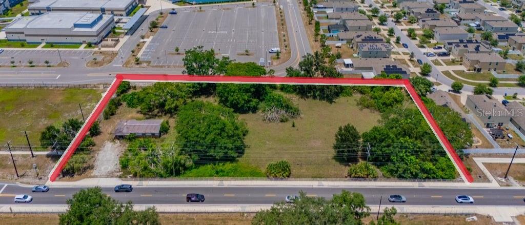 Opportunity Knocks! Prime Multi-Use Development Potential on Nearly 2 Acres! Discover the possibilities with this exceptional property offering just under 2 acres in a highly visible, high-traffic location. Featuring 414 feet of highway frontage, this high-and-dry parcel is not located in a flood zone, providing an excellent foundation for future development. Currently zoned AR, the property's future land use designation is planned for R-4, creating exciting potential for future residential or commercial uses. Buyers interested in rezoning should verify all intended uses with the county. With direct access to County Road 672, which sees approximately 16,400 vehicles per day, and located just minutes from US Highway 301, carrying an estimated 41,643 vehicles daily, this property offers outstanding exposure and accessibility. Ideal for a variety of potential uses, including a daycare, CPA office, professional office, title agency, or other approved business ventures (subject to county approval). With no HOA or CDD fees, you'll enjoy greater flexibility to explore your vision. Conveniently located near hospitals, medical offices, shopping, restaurants, the mall, and entertainment, this prime location combines visibility with convenience. The existing home is of no value - property being sold as is. The seller has never occupied the property. Don't miss this unique opportunity to invest in a property with outstanding location, visibility, and future potential. Schedule your private showing today!