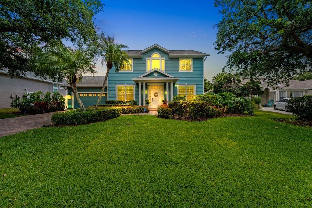 Rarely does a home come to market that has been curated with such impeccable taste and attention to detail. More reminiscent of the Hamptons than Bradenton, this exceptional residence offers coastal sophistication just minutes from the stunning Gulf beaches.

This charming two-story home features a first-floor ensuite bedroom complete with a marble-top vanity and walk-in shower, a formal dining room, and a beautifully renovated kitchen designed for both elegance and functionality. Imported Italian subway tile, stainless steel appliances, a Bosch dishwasher, induction cooktop, Advantium convection microwave, GE Profile oven, and oversized LG refrigerator all come together seamlessly. Soft-close cabinetry and pull-out pantry storage maximize convenience, while a reverse osmosis water system services the sink, refrigerator, and ice maker.

The sunny breakfast nook, framed by three windows, includes a custom built-in banquette with hidden storage below, and the adjacent high-top bar comfortably seats 4–5 guests. Completing the main living area is a warm and inviting family room with custom built-ins. Wood flooring runs throughout the home, including hand-scraped Anderson maple floors downstairs.

Upstairs, behind elegant French doors, the primary suite is a true retreat featuring vaulted ceilings, a private sitting area, and a fully renovated spa-inspired ensuite bath worthy of a luxury boutique hotel. Two additional bedrooms share an updated bath with tub and shower.

This home is as practical as it is beautiful. Impact-rated front windows, including the dramatic picture window in the vaulted foyer, provide peace of mind, while all remaining windows and doors are protected by attached hurricane shutters. Additional upgrades include a whole-house GENERAC generator powered by two 120-gallon propane tanks and remote-controlled impact shades protecting the rear lanai.

The list of special features continues: a custom outdoor shower and dressing area, Hunter Douglas plantation shutters throughout, tandem garage with workshop space, 80-gallon hybrid water heater, heated saltwater pool, and an incredibly private backyard designed perfectly for entertaining family and friends.

With countless thoughtful upgrades throughout, this enchanting property is ideally located near Robinson Preserve and just minutes from the world-famous beaches of Anna Maria Island.