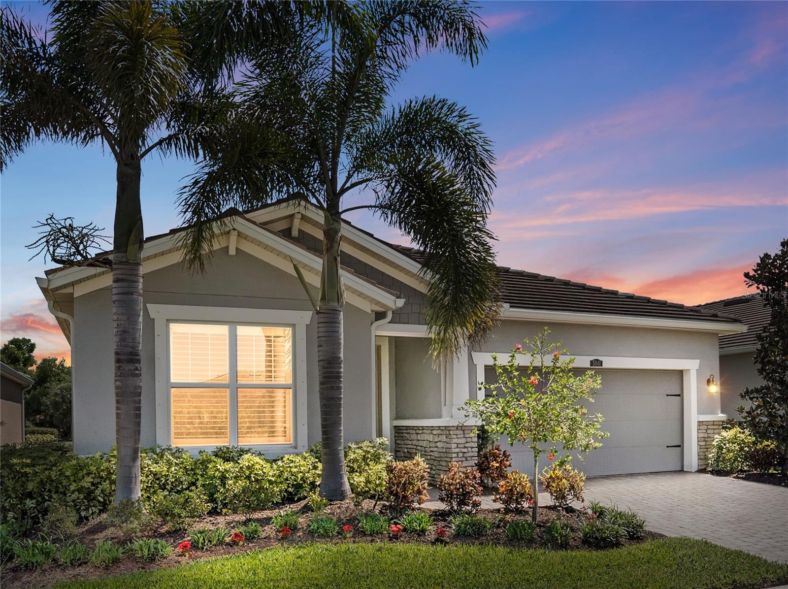 Accepting Back Up Offers - You’ll feel it before you can explain it. This home hasn’t really been lived in, and it shows. Built in 2020 inside the gated Sunrise Preserve community on Palmer Ranch, this 2 bedroom, 2 bath residence with a flex room offers approximately 1,843 square feet that feels closer to new than resale. As you walk through, there’s a noticeable difference in how everything presents, clean, well-kept, and lightly used in a way that stands out immediately.

The layout draws you in without effort. The main living space flows naturally, connecting the great room, dining, and kitchen in a way that feels open but still controlled. The flex room is currently set up as an office and additional living space, giving you a clear sense of how it can function day to day. At the same time, it can easily transition into a third bedroom, gym, media room, or whatever fits your lifestyle, giving the home built-in flexibility over time.

The kitchen sits at the center, keeping everything connected while maintaining balance. Natural gas adds another layer of value that buyers actively look for, with a gas cooktop, the ability to run a gas dryer, and a gas line already in place for an outdoor grill or future kitchen.

Then your attention shifts outside. The lanai features a clear view screen enclosure with no visual obstructions, creating uninterrupted sightlines across the water. With eastern exposure, you get direct sunrise views reflecting off the water, giving you a setting that feels calm, private, and hard to replicate. The travertine stone patio is another detail that makes a difference, staying cooler underfoot and offering a more refined, durable finish compared to standard pavers, especially in the Florida heat. This entire space becomes a natural extension of the home and part of your daily routine.

The primary suite is positioned for separation and comfort, while the second bedroom and overall layout maintain flexibility without disrupting the flow. The footprint remains efficient and easy to manage, supported by newer construction that keeps maintenance simple.

Sunrise Preserve offers gated entry and a full lifestyle experience with a clubhouse, fitness center, outdoor bar, zero entry saltwater pool with a dedicated lap lane, sun deck, spa, fire pit, tennis and pickleball courts, and walking trails. It’s an active community with consistent social engagement and events.

The location ties everything together, just minutes to Siesta Key Beach, UTC, downtown Sarasota, and SRQ Airport, giving you access without inconvenience. With no CDD fees and natural gas, this home brings together features that are increasingly hard to find in one place.

Homes like this tend to create a quiet kind of demand. Not rushed, but decisive. And when it fits, you’ll know.