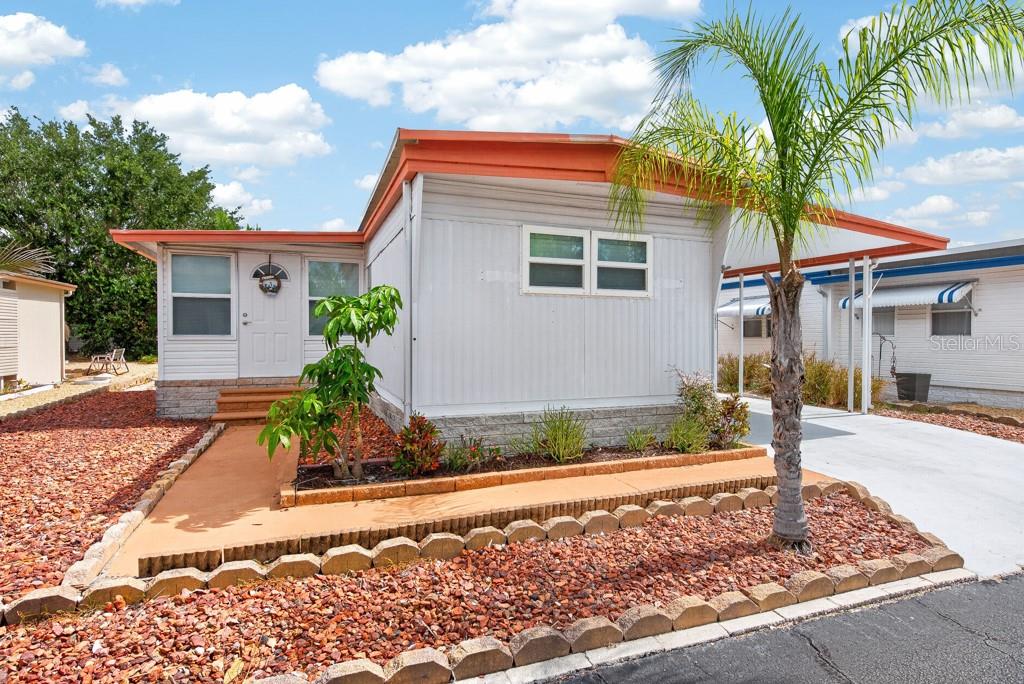 No lot rent here—you own the land! Nestled within a gated 55+ community with a low HOA fee of just $400 per year, this completely remodeled 2-bedroom, 2-bath home with a 13' x 9' versatile bonus room offers the perfect blend of comfort, style, and affordability. Extensively updated from top to bottom, the home features all-new PVC plumbing, updated electrical outlets, new flooring, fresh drywall, and interior paint throughout. The beautifully redesigned kitchen serves as the heart of the home, showcasing custom cabinetry with soft-close, dovetail drawers, granite countertops, a tiled backsplash, and a charming farmhouse sink. Both bathrooms have been thoughtfully renovated with modern finishes, creating a fresh and move-in-ready living space. Outside, you'll find a long-covered driveway providing ample parking, along with a large storage shed for tools, hobbies, or extra belongings. Residents also have the option to join the nearby TAT Civic Association, offering an impressive array of amenities including RV and boat storage, fitness classes, social activities, a food pantry, and rentable community spaces. Whether you're looking for an active social calendar or a more relaxed lifestyle, the choice is yours. Ideally located just minutes from the Gulf Coast, you'll enjoy easy access to fishing, boating, and breathtaking Florida sunsets. Explore the historic Tarpon Springs Sponge Docks with their waterfront dining, unique shops, and rich Greek heritage, or spend the day at nearby Anclote River Park and Key Vista Nature Park, where beaches, nature trails, and scenic views await. The popular Pinellas Trail is also just a short drive away, offering miles of biking and walking paths under the Florida sunshine. This is Gulf Coast living at its best—offering exceptional value, modern updates, and a welcoming community atmosphere without the premium price tag. Schedule your showing today and see everything this beautifully renovated home has to offer.