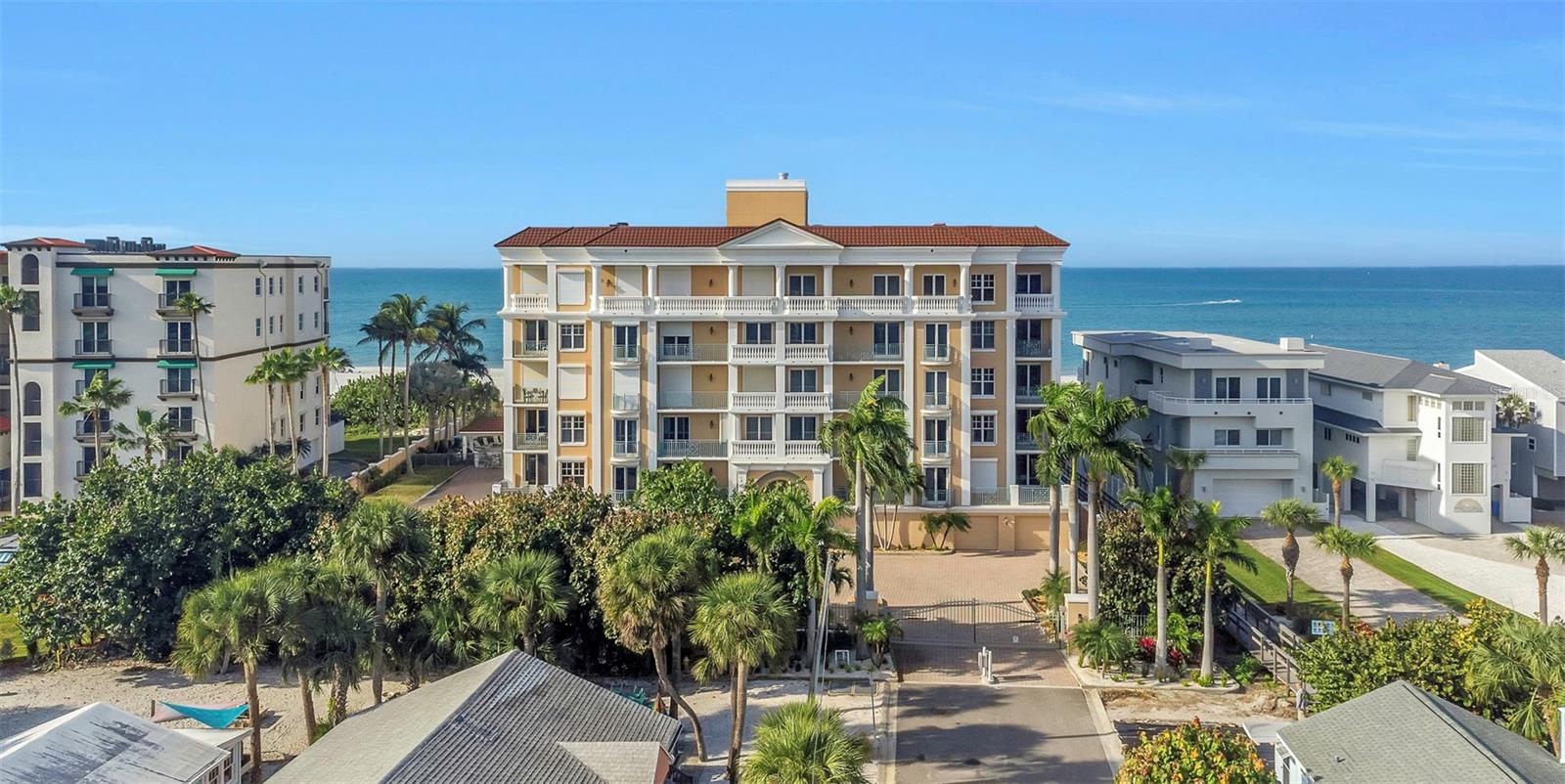 Step into a world of coastal elegance with this extraordinary 3,443 sq ft beachfront masterpiece in the exclusive Vittoria Condominium on Treasure Island's award-winning shores. This rare 3-bedroom, 3.5-bath condo, complete with a stylish office, redefines beachfront living. Private elevator access opens to a grand foyer, welcoming you into a stunning retreat with ocean views from every room and perfect for hosting unforgettable gatherings. The kitchen flows effortlessly into a dining area with a chic wet bar and a spacious living room, where expansive windows and a sprawling balcony frame breathtaking views of the Gulf's crystal waters, sugary sands, and spectacular sunsets. Each generously sized bedroom suite offers an en-suite bathroom and expansive walk-in closet in the luxurious primary suite with private balcony that overlooks the beach, tropical pool oasis with spa, and Treasure Island's iconic beaches. Soaring ceilings, abundant natural light, and meticulous craftsmanship create a warm, inviting haven that feels like home from the moment you arrive. Nestled in the gated Vittoria community, steps from John's Pass Village and downtown Treasure Island, this is a rare opportunity to claim your slice of paradise. Built in 2004, this gated enclave of just 15 luxury residences offers unmatched privacy with secure lobby access, a private two-car garage, and direct elevator entry to each home. This condo is a coveted Grandview floorplan which does not come available often. Schedule your private tour of this exclusive beachfront beauty.