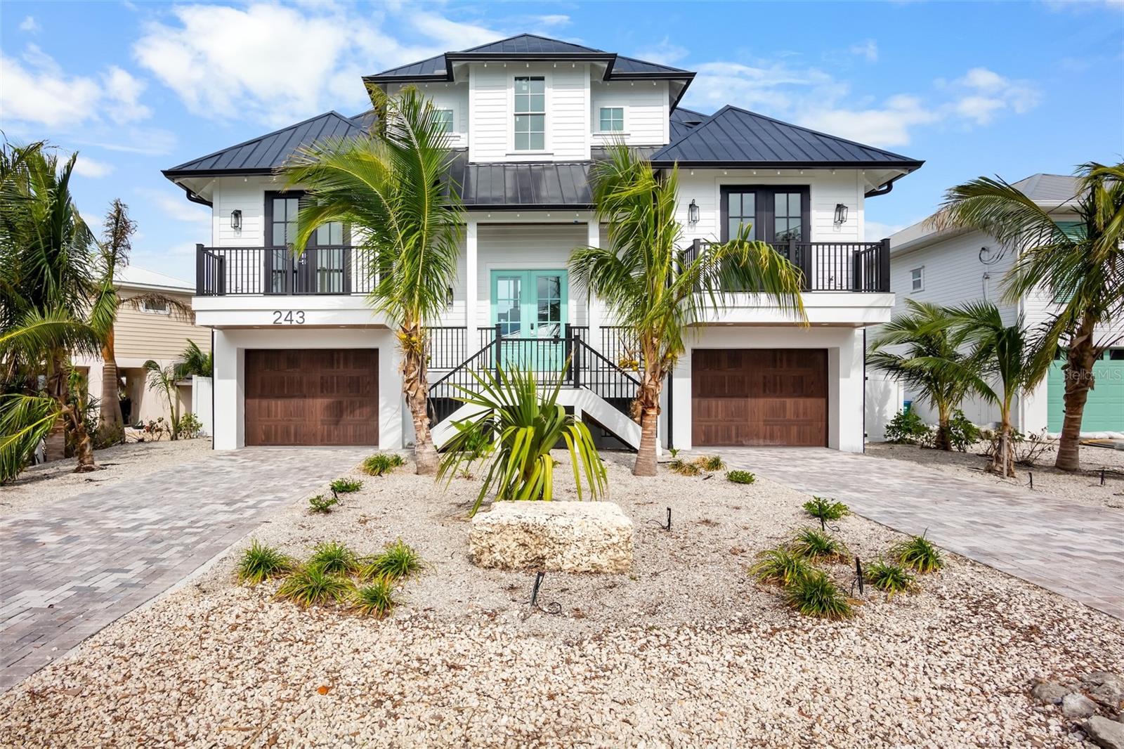This almost brand-new, (2024) fully furnished 4-bedroom, 4.5-bath luxury residence delivers the perfect blend of island relaxation and modern sophistication. Built to the highest standards and unaffected by recent hurricanes, it offers peace of mind along with exceptional design. A charming front entry welcomes you into a bright, open great-room floor plan that seamlessly connects the living area, dining space, and chef’s kitchen. The kitchen features a large entertaining island, premium finishes, and generous seating—ideal for hosting family and friends.
The primary suite is a serene retreat with a spa-style ensuite bath, creating a private sanctuary for unwinding after a day in the sun. Two more king bedrooms all with en-suite bathrooms allow privacy for guests. Everyone will love the bunk room also with en-suite bathroom.
Step outside to expansive outdoor spaces surrounded by lush tropical landscaping. Enjoy the Florida sunshine by the heated pool and infinity edge spa, relax with a drink in hand, or gather for evening conversations under the stars. The turfed backyard provides a lush area for pets and additional seating areas.
The home also features rooftop deck with sweeping intercoastal water views, perfect for taking in unforgettable sunsets. Multiple balconies around the allows you to enjoy the incredible island weather.
A spacious 2-car garage provides room for vehicles, a golf cart, and additional storage. Every detail has been thoughtfully designed for comfort, convenience, and effortless island living.  
Situated in one of Anna Maria Island’s most desirable areas, this home places you moments from everything that makes island life special. Take advantage of the private community boat ramp and quick access to the beautiful waters of Tampa Bay and the Gulf. 
Currently utilized as a short-term vacation rental with great rental revenue and many 5-star reviews, this home provides a fantastic investment opportunity.