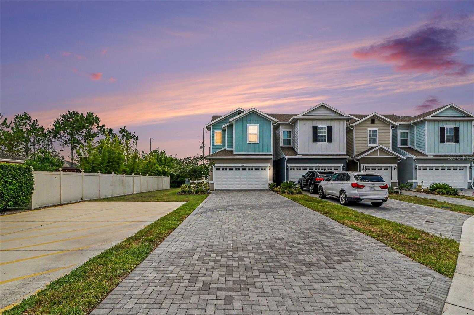 BETTER THAN NEW! This BEAUTIFULLY MAINTAINED two-story END-UNIT townhome offers extra privacy and a spacious layout. An extra long driveway and attached two-car garage provide AMPLE PARKING and convenience. Upon entry, you'll find a welcoming living area that flows seamlessly into the open kitchen and dining space, creating the perfect setting for everyday living and entertaining. All bedrooms are located on the second floor, including the SPACIOUS PRIMARY SUITE featuring a private full bathroom and walk-in closet. A versatile loft or sitting area upstairs provides additional living space ideal for a home office, reading nook, play area, or media space. Step outside to enjoy the private rear patio, perfect for relaxing or enjoying Florida's beautiful weather. Combining comfort, functionality, and an ideal end-unit location, this townhome is ready for its next owner. Don't miss your opportunity to make it yours! DISCOUNTED RATE OPTIONS and NO LENDER FEE FUTURE REFINANCING may be available for qualified buyers of this home.