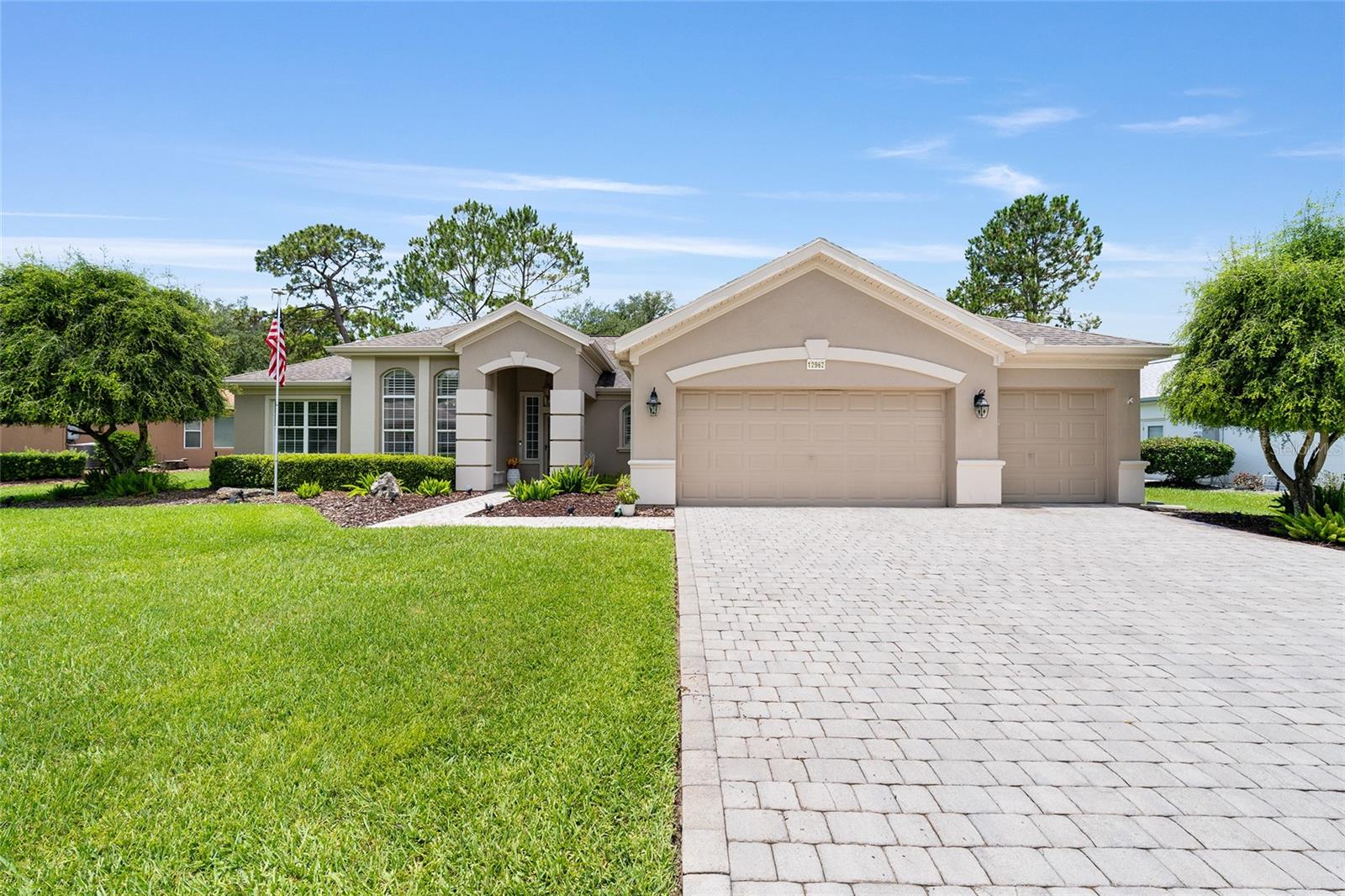 MOVE-IN READY and perfectly positioned on a picturesque golf course lot, this popular Sanibel model offers 2 bedrooms, 2 baths, plus a spacious den and boasts exceptional curb appeal from the moment you arrive. A designer paver driveway and walkway, charming umbrella awnings, and professionally landscaped beds of shrubs and flowers create a warm welcome. Step through the leaded glass front door into the foyer where your eyes are immediately drawn to the stunning views of the 6th hole of the Memorial Golf Course framed by mature pine trees. Inside, you'll appreciate the open and inviting floor plan featuring ceramic tile in all the heavy traffic areas, engineered wood flooring in both bedrooms, and absolutely no carpet. The beautifully upgraded kitchen is a chef's delight with gorgeous cabinetry accented with crown molding, double pull-out shelves, Corian beveled-edge countertops, newer stainless steel appliances, and an expanded breakfast nook complete with built-in china cabinetry. Plantation shutters throughout add elegance and warmth to every room. The spacious great room opens through French doors to a glass-enclosed lanai featuring its own mini-split HVAC system, creating additional year-round living space. Prefer the outdoors? Step into the birdcage and relax while enjoying the Florida sunshine and tranquil golf course setting. The primary suite is a peaceful retreat highlighted by a bay window, plantation shutters, a professionally designed closet system, and an updated bath featuring dual raised vanities with granite countertops, new mirrors and lighting, a beautifully remodeled shower, soaking tub, and a comfort-height toilets Additional features include an inside laundry room with built-in workstation, a private shared well for irrigation, a Generac Generator, and furniture that is negotiable. Car enthusiasts and hobbyists will love the oversized 27-foot extended garage plus the 21-foot golf cart garage, offering abundant space for vehicles, storage, and toys. With a newer roof installed in 2018, HVAC 2010 outstanding upgrades throughout, and an unbeatable golf course location, this exceptional home is ready for you to move right in and start enjoying the Florida lifestyle. CALL TODAY!
