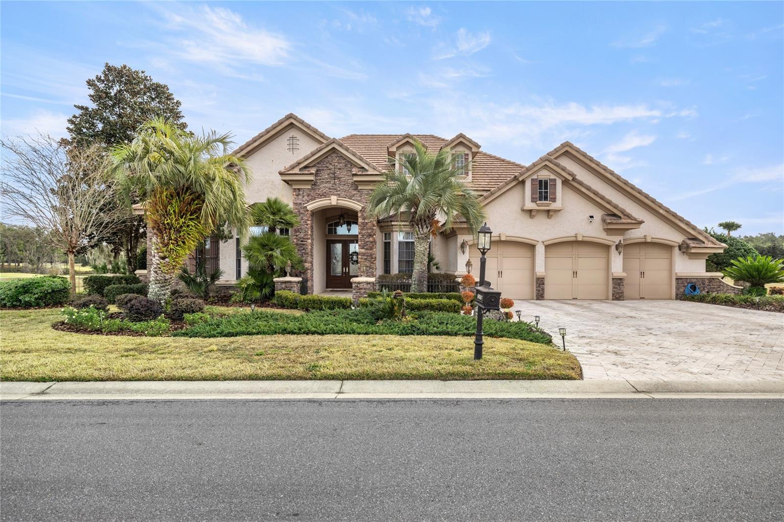 Discover refined luxury living in the gated golf community of Juliette Falls Golf Community. Impeccably maintained and showing true pride of ownership—this exceptional pool home blends elegant design with breathtaking natural surroundings.
At the heart of the home is a chef’s gourmet kitchen appointed with premium Viking appliances, a gas cooktop, wet bar, wine cooler, and an expansive walk-in pantry—perfectly designed for both everyday living and upscale entertaining. The thoughtfully designed floor plan offers a balance of formal and casual living spaces, anchored by a cozy fireplace that adds warmth and charm.
Step outside to a spectacular resort-style outdoor living space where the screen-enclosed, heated saltwater infinity pool and spa overlook a stunning panoramic water view. The tranquil pond creates a serene, ever-changing backdrop—reflecting sunsets across the water, attracting graceful wildlife, and offering a sense of privacy and peacefulness rarely found in golf course communities. The outdoor kitchen with built-in grill makes hosting effortless while guests enjoy the sweeping water and golf course vistas.
The luxurious owner’s suite serves as a private retreat with direct pool access and a spa-inspired bath featuring a jetted soaking tub and spacious walk-in shower. The home includes four bedrooms (one ideal as an executive office), a dedicated study, and a three-car garage equipped with an EV charging port.
Perfectly positioned near the crystal-clear waters of the Rainbow River and several beautiful state parks, this residence also offers access to the community’s top-rated championship golf course, elegant clubhouse, and restaurant. Furnishings optional - available as-is—making this a rare opportunity to own a luxury retreat with one of the most captivating water views in Juliette Falls.
