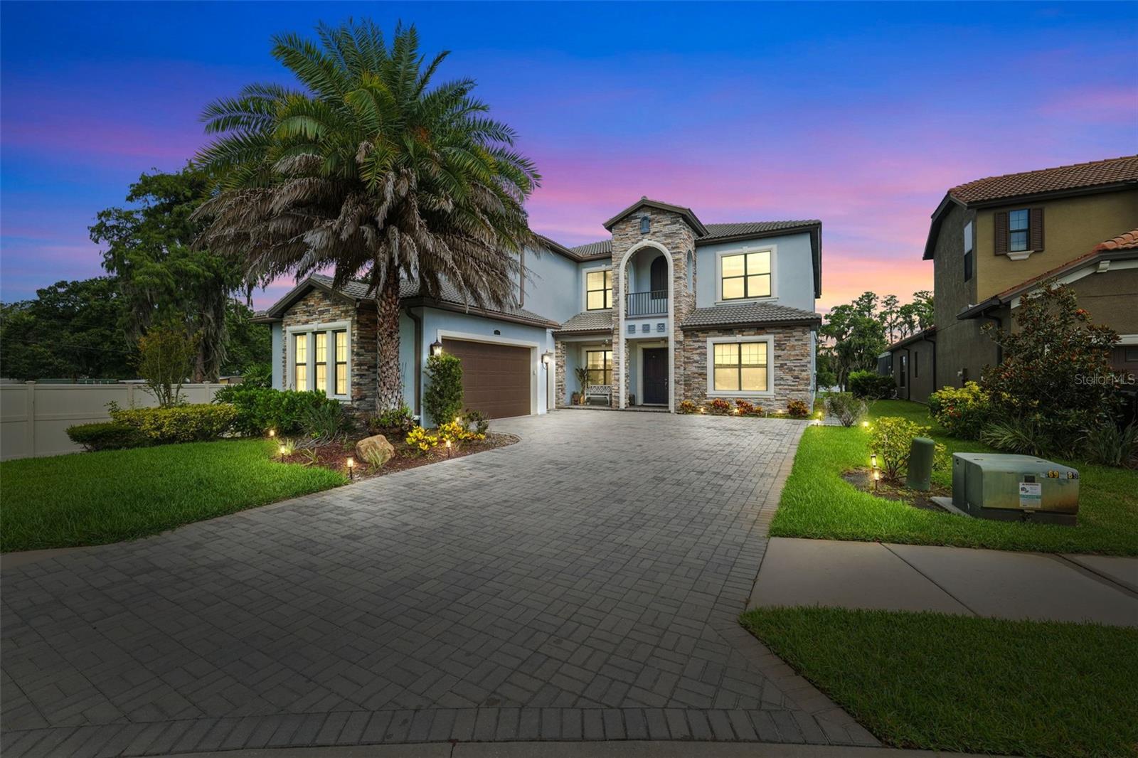 Rare Luxury Waterfront Estate on Lake LeClare!

Dive into luxury with a stunning 45-foot resort-style pool, heated iridescent stone spa, expansive waterfront backyard, and private dock on beautiful Lake LeClare, a private ski lake. Situated on the largest lot in the community, this extraordinary outdoor oasis offers the ultimate Florida waterfront lifestyle with endless space to entertain, relax, play, boat, ski, and enjoy breathtaking sunsets.

This exceptional 5-bedroom, 4.5-bath residence is tucked away on a quiet cul-de-sac in one of Northdale's desirable boutique communities. Inside, discover expansive living spaces that flow effortlessly from room to room, creating the perfect setting for both everyday living and grand entertaining.

Every bedroom features a walk-in closet, while the luxurious upstairs primary suite boasts a private waterfront balcony, creating the perfect retreat for morning coffee and unforgettable evening sunsets. Additional highlights include a 3-car garage, spacious living and dining areas, generous storage throughout, and seamless indoor-outdoor living designed for effortless entertaining.

Ideally located just minutes from the Veterans Expressway, Tampa International Airport, premier shopping, dining, and entertainment, this home offers the perfect blend of tranquil waterfront living and everyday convenience.

Luxury. Privacy. Waterfront. Welcome home.