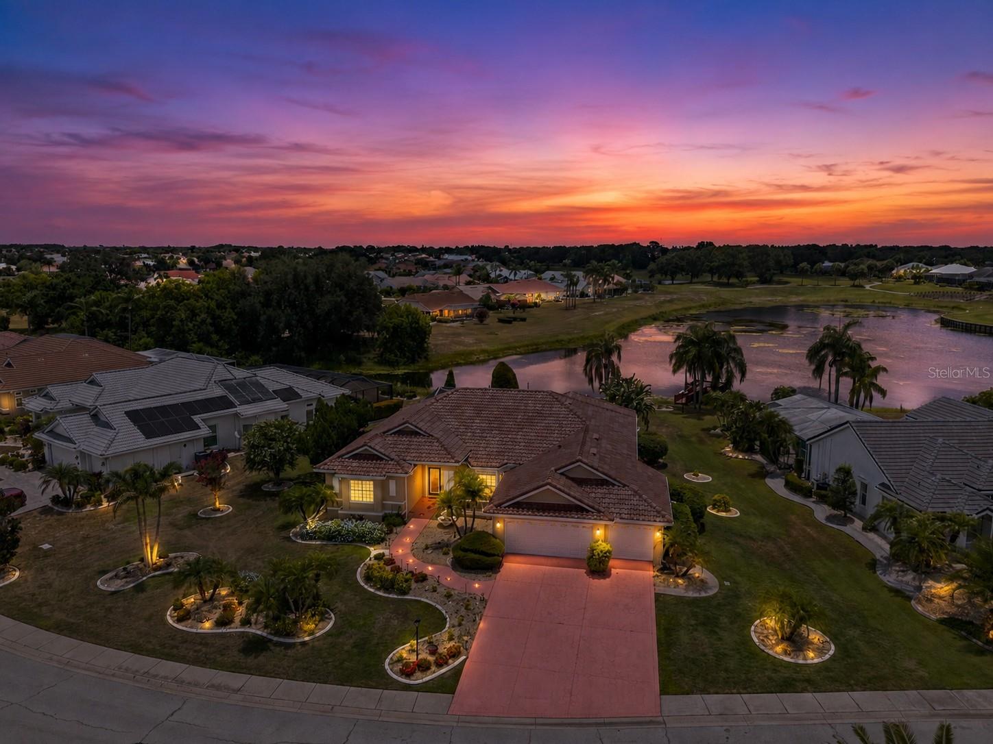 Welcome to this beautifully maintained pool home in Sun City Center. Situated on an oversized lot this property offers stunning water views, exceptional privacy and resort-style living both inside and out. Major updates provide peace of mind, including a NEW TILE ROOF, new irrigation system, fresh exterior paint, new flooring and new washer and dryer. For added protection and convenience, EVERY DOOR AND WINDOW is equipped with MOTORIZED STORM SHUTTERS, a rare and valuable feature. The spacious floor plan includes a large kitchen featuring granite countertops, a flat cooktop, double ovens, abundant cabinetry and generous workspace making it ideal for both everyday living and entertaining. The primary suite offers a luxurious retreat with split vanities, a garden tub with jets and a separate shower stall. Outdoor living is equally impressive with a screen-enclosed pool and spa, perfect for enjoying Florida's year-round sunshine. The pool was resurfaced approximately three years ago and the screen enclosure was updated at the same time, creating a fresh and inviting outdoor oasis. A spacious 3-car garage provides ample room for vehicles, golf carts, storage and hobbies. The meticulously maintained landscaping enhances the home's curb appeal and showcases the pride of ownership throughout the property. Residents of Sun City Center enjoy access to an extensive array of amenities, including multiple clubhouses, fitness centers, indoor and outdoor pools, golf courses, pickleball and tennis courts, social clubs, arts and crafts activities and countless opportunities for recreation and entertainment. This exceptional waterfront home combines thoughtful updates, outstanding storm protection, beautiful outdoor living spaces and access to one of Florida's premier active adult communities. Schedule your private showing today.