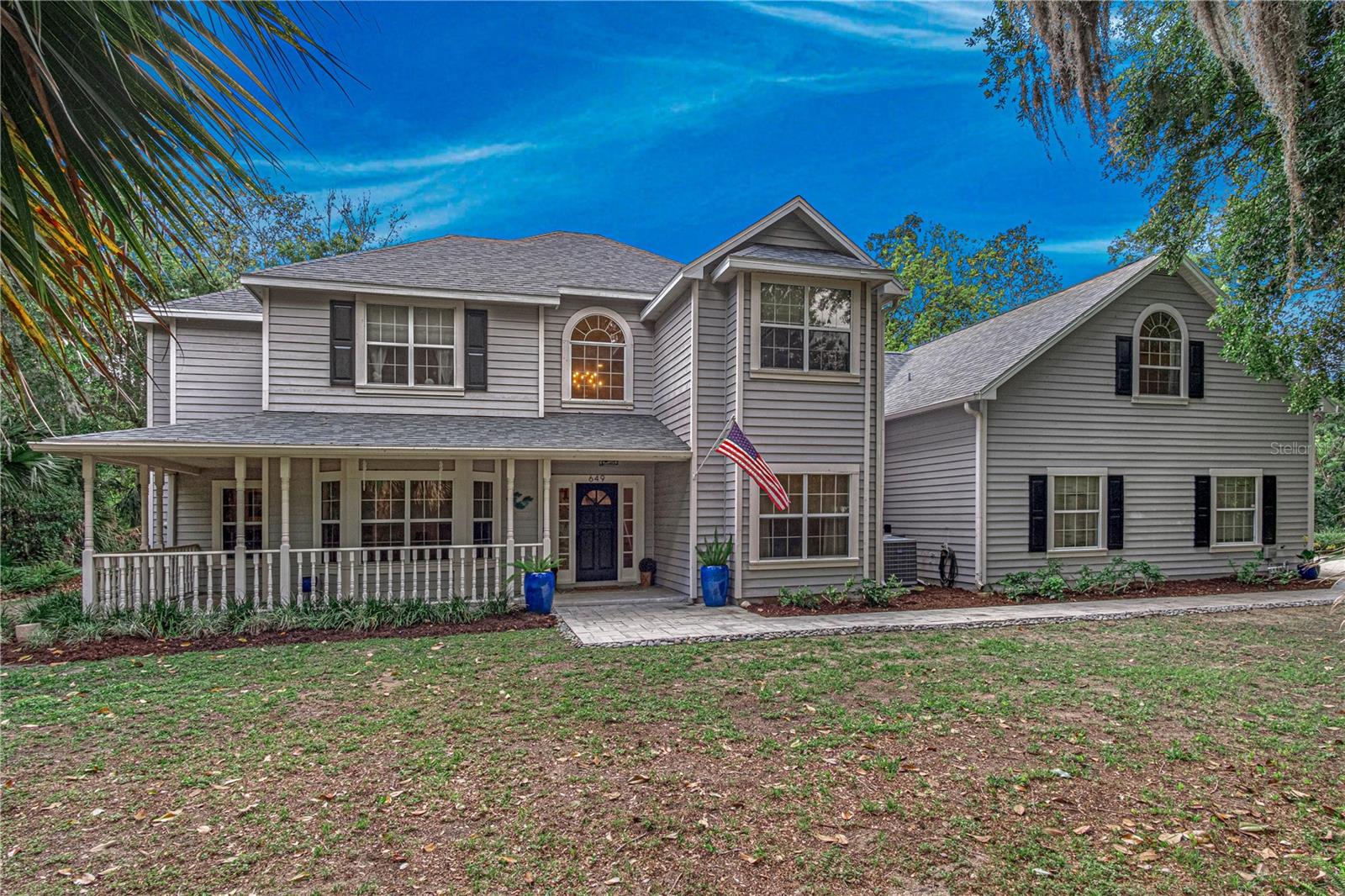 Tucked away on over an acre of beautifully wooded privacy, this Bentwood estate is where everyday living feels like a private retreat. Welcome to 649 Charmagne Lane, a stunning estate nestled in the desirable Bentwood community of Port Orange. Situated on just under 1.25 acres, this expansive 5-bedroom, 5-bathroom home offers the perfect blend of luxury, privacy, and functionality. Designed with both entertaining and everyday living in mind, this residence features generous living spaces, a 4-car garage, and a thoughtfully designed layout ideal for hosting guests or creating your own private retreat. Step outside to your backyard oasis, complete with a recently repaved inground pool and spa, a cozy firepit, lush landscaping that creates a peaceful, secluded setting perfect for hosting or relaxing under the stars. The Bentwood community enhances lifestyles by offering exclusive access to the Spruce Creek River via a private community dock, which provides opportunities for kayaking, fishing, and scenic relaxation. This exceptional property delivers space, elegance, and a refined Florida lifestyle in one of Port Orange’s most sought-after neighborhoods