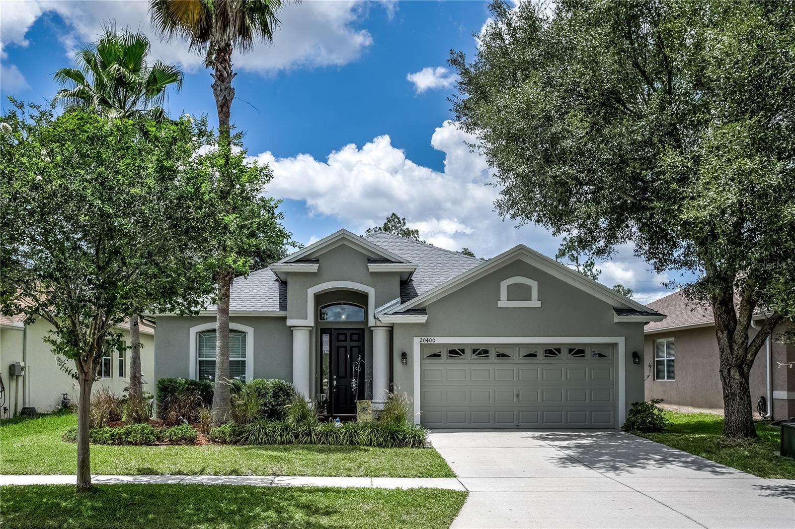 Welcome to Stonegate – A Gated Community with Exceptional Amenities! LOW HOA and NO CDD.

Discover the perfect blend of comfort, convenience, and lifestyle in the highly desirable Stonegate community. Residents enjoy a private gated entrance, an impressive clubhouse featuring a fitness center and spacious gathering room with a full kitchen, a resort-style pool, playground and a scenic fishing pond.

This beautifully maintained HOME offers 3 bedrooms plus a DEN/OFFICE, 2 bathrooms, and approximately 1,970 square feet of thoughtfully designed living space, situated on a private homesite with no rear neighbors. NEW ROOF MAY 2026, A/C 2022.

Step inside to find a welcoming den/office with elegant French doors, ideal for working from home or creating a quiet retreat. The gourmet kitchen is a chef's dream, featuring tall cabinetry, pull-out drawers, stainless steel appliances, a center island, and abundant storage. The kitchen flows seamlessly into the dining and living areas, creating an open-concept layout perfect for entertaining.

The spacious living room showcases a tray ceiling with ceiling fan and opens through sliding glass doors to a screened, covered lanai, where you can relax and enjoy peaceful backyard views and added privacy.

The oversized owner's suite serves as a private retreat with a tray ceiling and a luxurious en-suite bathroom. Master bathroom with dual sinks, walk in shower, and a walk in closet. Two additional guest bedrooms feature engineered hardwood flooring and share a well-appointed guest bathroom with a bathtub.

Additional highlights include:

Indoor laundry room with washer and dryer included,
Gas-powered home with gas stove, water heater, and dryer.
Garage with utility sink and excellent storage closet.
Private backyard with no rear neighbors.

HOA fees include:
GATED communitty entry,
CABLE TV,
High-speed INTERNET and 
CLUBHOUSE access with ammeneties.
This beautiful home offers an exceptional opportunity to enjoy Florida living in one of the area's most sought-after communities. Schedule your private showing today!