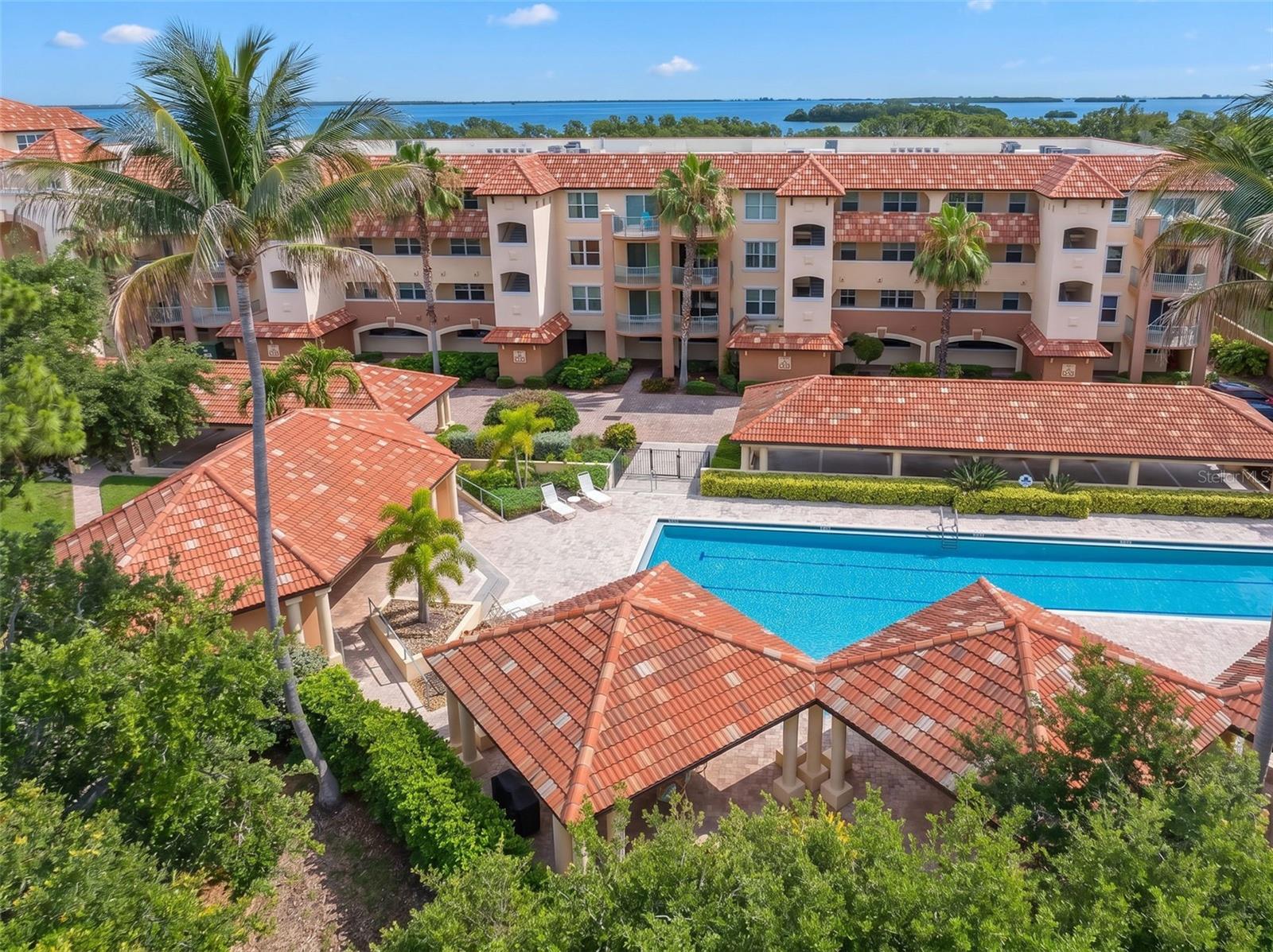Welcome to Hidden Lagoon, one of Tierra Verde's most sought-after gated waterfront communities, where boutique luxury meets the Florida coastal lifestyle. This beautifully appointed 3-bedroom, 3-bath residence has had only one owner who used it as a secondary residence.  It feels like brand new. The unit  offers a spacious open-concept floor plan, a separate den or office, and a large waterfront balcony overlooking the tranquil lagoon and community boat slips. Elegant crown molding enhances the living spaces, while the waterfront primary suite serves as a private retreat, a spa-inspired bath featuring, separate soaking tub, bidet, dual vanities, and a custom walk-in closet. The spacious second bedroom offers an en-suite bath and private covered balcony overlooking the resort-style pool, creating the perfect guest retreat. The third bedroom also enjoys beautiful pool views. Hidden Lagoon lives more like a waterfront home than a condominium, thanks to its generous floor plans, semi-private elevator access, and generous balconies where one can start the day enjoying serene morning sunrises as well as Florida's abundant wildlife including dolphins & manatees. The beautifully maintained grounds offer a resort-style atmosphere. Community amenities include two pools, a jacuzzi, fitness center, tennis and pickleball courts, waterfront boardwalks and walking paths, fishing piers, kayak and paddleboard storage, and boat slips available for purchase or lease. Ideally located near Fort De Soto Park, Shell Key Preserve, St. Pete Beach, Pass-a-Grille, Downtown St. Petersburg, and Tampa International Airport, this exceptional residence offers the perfect balance of luxury, convenience, and waterfront living. Sports enthusiasts will enjoy the easy access to the Tampa Bay Rays, Lightning hockey and Buccaneer football! Whether you're seeking a full-time residence, seasonal escape, or lock-and-leave retreat, this is your opportunity to enjoy one of Tierra Verde's premier waterfront communities. Why vacation in paradise when you can live it every day?
