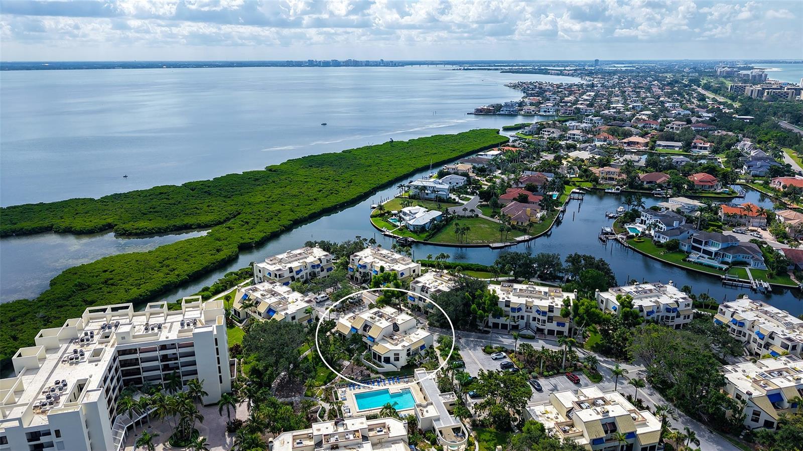 Experience the ultimate resort lifestyle—where every day feels like a vacation. Take a refreshing dip in the pool, enjoy a tranquil walk along the bay, or bask in the warm Florida sun on the white sandy beach. This spacious 2-bedroom, 2-bath townhome offers both comfort and elegance, featuring soaring ceilings and an open-concept floor plan. The recently updated kitchen is equipped with all the modern upgrades, making it perfect for both casual meals and entertaining. The guest bedroom includes custom built-ins with ample storage and a convenient desk, ideal for a home office. The primary suite is both roomy and inviting, enhanced by built-in bookshelves and an en-suite bath filled with natural light from a skylight above the tub. Additional highlights include an interior laundry room and an oversized garage with sleek epoxy flooring, easily accommodating 4–5 vehicles. Step out onto your private lanai, where serene views of the community pool create the perfect setting for relaxation and contentment. Located in the prestigious, guard-gated community of Bay Isles, this residence is just a short stroll to shopping and the newly opened St. Regis Resort. Community amenities abound, including tennis courts, a fitness center, and onsite management. Residents also enjoy access to a private beach club offering Longboat Key’s famous white sand beaches, a shaded pavilion, restrooms, and event space. Enhancing this resort-style living, Bay Isles residents may also enjoy memberships at the exclusive Longboat Key Club, featuring a world-class marina, championship golf courses, renowned tennis gardens, and fine dining.
This is more than a home—it’s a lifestyle. Welcome to your Longboat Key retreat.