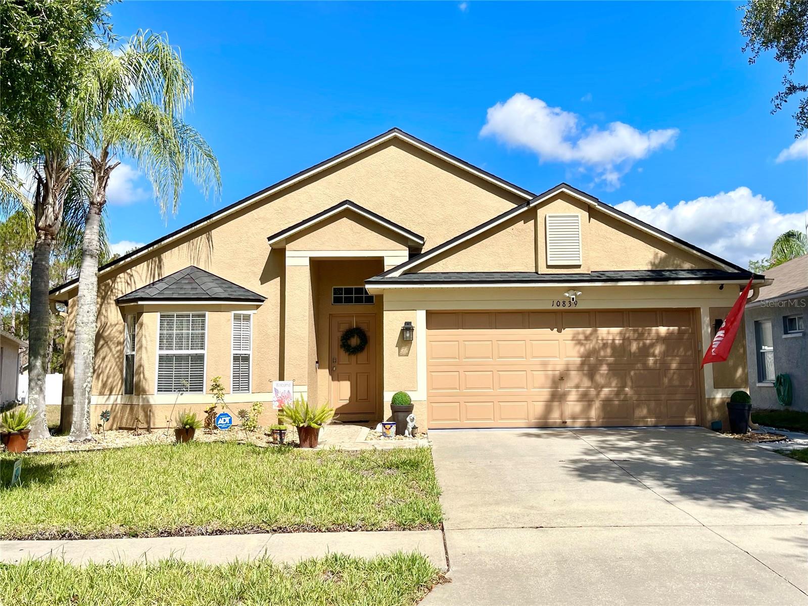 Experience the lifestyle offered by Suncoast Lakes in this spacious 4-bedroom, 2-bath, 2-car garage home situated on a quiet cul-de-sac in Land O' Lakes. Offering more than 2,000 square feet of living space, this single-story home features tile flooring throughout, updated bathrooms, generous living and dining areas, and an open floor plan designed for everyday living and entertaining. The enclosed, fully screened lanai includes a section with solar protection, providing a comfortable outdoor space for relaxation and enjoyment.
Residents of Suncoast Lakes have access to community amenities including a clubhouse, community pool, playground, basketball court, tennis courts, sidewalks, and green spaces. Conveniently located near SR-54 and the Suncoast Parkway/Veterans Expressway, the property offers access to shopping, dining, parks, medical facilities, Tampa International Airport, and Gulf Coast beaches. Additional features include a low HOA and no CDD fees. Buyers are encouraged to verify all measurements, HOA information, and any flood zone determinations.