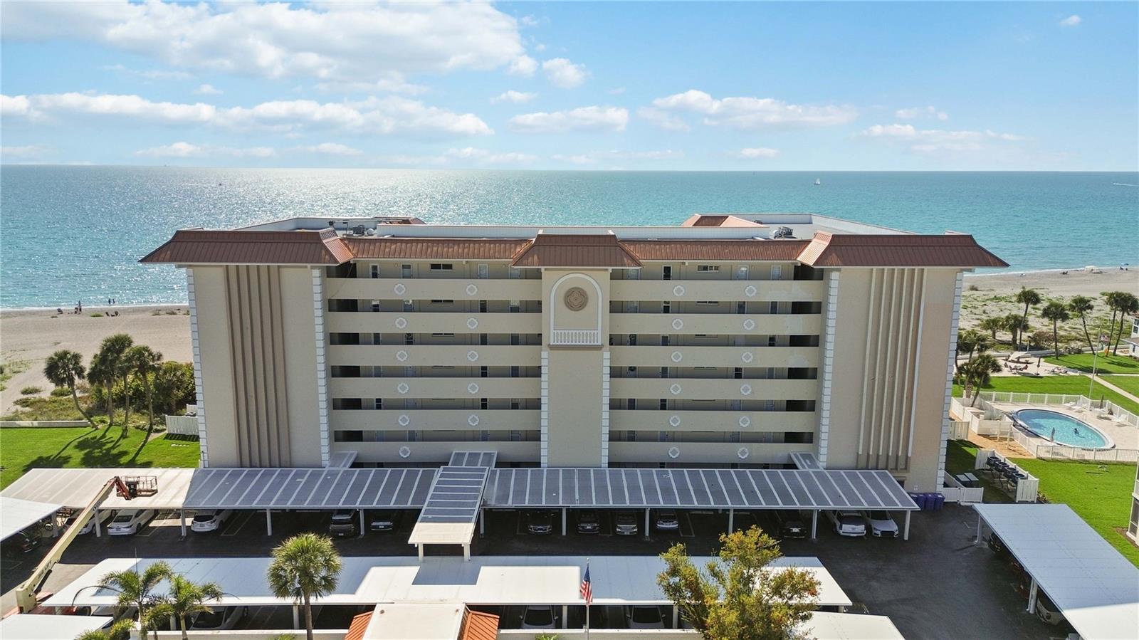 Experience the best of coastal living from this beautifully updated 2-bedroom, 2-bathroom beachfront condominium on Venice Island, ideally positioned to capture southern-facing Gulf views and breathtaking beach vistas. Just steps from the sand, this residence offers an exceptional blend of comfort, style, and location.

Inside, the home has been thoughtfully refreshed with luxury vinyl plank flooring, fresh interior paint, and plantation shutters throughout, creating a light and inviting coastal ambiance. The well-appointed kitchen features new Samsung white glass appliances, while the spacious layout includes a large primary suite with en-suite bath and walk-in closets, offering both comfort and privacy.

One of the most impressive features is the expansive 31-foot lanai, where you can relax and enjoy long, unobstructed views of the beach and turquoise Gulf waters, enhanced by its desirable southern exposure—filling the home with natural light throughout the day.
Additional upgrades include a new hot water heater and new HVAC system. The unit also offers an in-unit laundry hook-up for added convenience.

Residents enjoy amenities designed to complement the beachfront lifestyle, including a large beachfront pool, outdoor beach showers, BBQ grilling area, and bike & kayak storage, along with a laundry facility conveniently located on the same floor. Ideally located across the street from the Freedom Boat Club, Venice Yacht Club, and Pelican Bay, where boat slips may be available for rent.

The Towers is a pet-friendly building—one of the few on Venice Island.

The monthly condo fee includes internet, cable, water, sewer, trash, exterior maintenance, and pest control, allowing for easy, maintenance-free living. Each unit also includes a private 5’ x 4’ storage cage located in the shared laundry area on your floor—perfect for storing beach gear and bikes. A well-managed association ensures the community is consistently maintained and cared for.

Enjoy the convenience of being just minutes from historic downtown Venice, where you’ll find boutique shopping, dining, tennis and pickleball courts, and a vibrant cultural scene.

Whether you're seeking a full-time residence, seasonal retreat, or investment opportunity, this is a rare opportunity to own a prime Gulf-view property in one of Venice Island’s most desirable beachfront locations