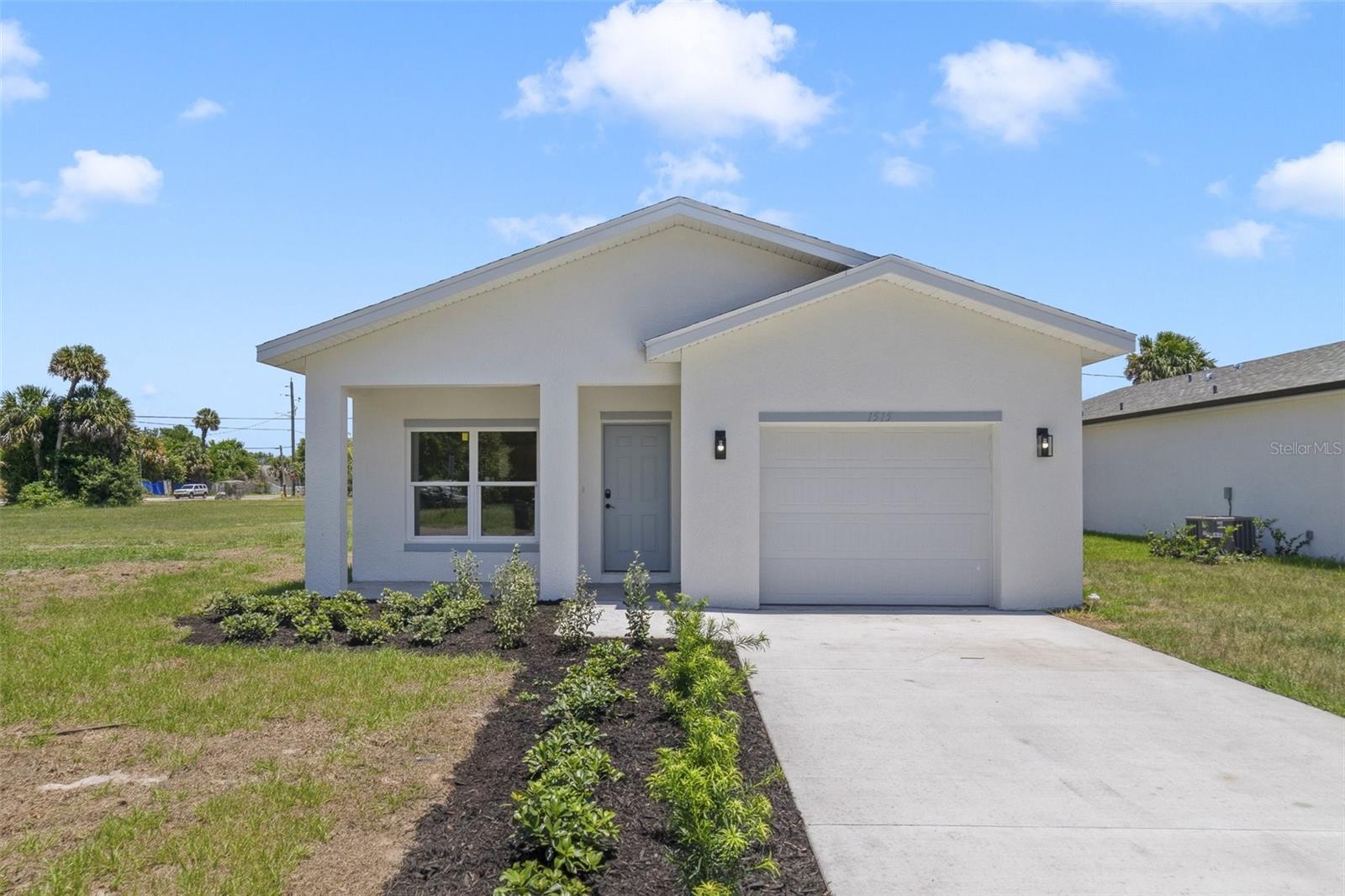 Virtually Staged. **NEWLY BUILT ~ 2025** Welcome to Elizabeth Ave, nestled in the growing Lincoln Park community of Titusville – just minutes from the Indian River, with NO HOA and convenient access to local shopping, dining, Sand Point Park, and more! This light-filled home features sleek gray toned CERAMIC TILE FLOORS throughout, blending durability with modern style. A fresh, neutral color palette enhances the bright, OPEN CONCEPT layout, creating a clean canvas for your personal touch. The heart of the home is the kitchen, offering STAINLESS STEEL APPLIANCES, shaker-style cabinetry, solid surface countertops, a center ISLAND with breakfast bar seating, and a WALK-IN PANTRY – perfect for both daily living and entertaining. A desirable SPLIT FLOOR PLAN ensures privacy, with the spacious PRIMARY SUITE boasting a large WALK-IN CLOSET and a luxurious en-suite bath featuring an extended dual-sink vanity and a custom-tiled WALK-IN SHOWER. Two additional bedrooms share a second full bath with matching modern finishes. Located in an established area experiencing new growth, this home is surrounded by a blend of charming older homes and new construction. Whether you are a first-time buyer or seeking a strong investment opportunity, Elizabeth Ave offers incredible value, style, and convenience. Schedule your private showing today! Photos are of a model home & some features, appliances, etc., may vary slightly. **Seller may consider buyer concessions if made in an offer**