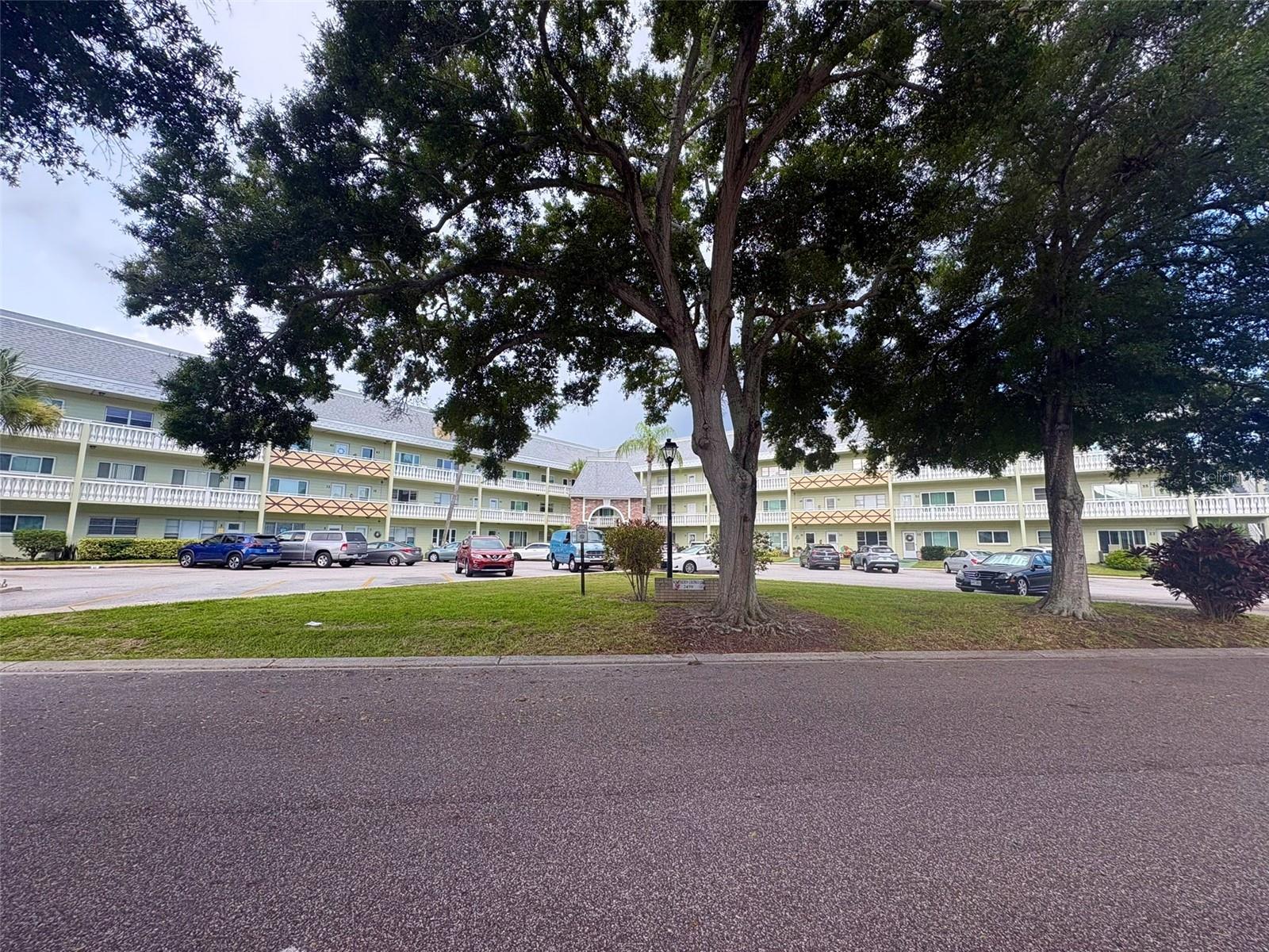 Fl living at it's finest! Welcome to this beautifully updated top floor (no neighbors above) 2 bedroom, 1 bath FURNISHED condo located in the highly sought after 55+ resort style community of On Top of the World. Offering 1100sf of thoughtfully updated living space, this move in ready home combines comfort, style, & peace of mind. Major updates include a BRAND NEW AC (6/26), HURRICANE IMPACT WINDOWS, NEW ELECTRIC PANEL WITH WHOLE HOME SURGE PROTECTOR (2025) & WATER HEATER INSTALLED IN 2017. The home has been exceptionally maintained & features high end carpeting with premium padding in the living room and bedrooms and modern wood look laminate in the kitchen and FL room. The beautifully REMODELED KITCHEN is a stand out featuring soft close cabinetry extending to the ceiling, elegant quartz countertops, a stone tile backsplash & updated appliances (2018). The RENOVATED BATHROOM offers a stylish tiled walk in shower with seamless glass doors for a spa like feel. Laundry located on the 2nd floor of the building. Enjoy peaceful views of the lush green space from this desirable end of street location on a quiet cul-de-sac. Whether you are looking for a year round residence or the perfect FL retreat, this home checks every box! Plus you are a short drive from the world renowned Gulf Coast beaches, shopping and dining! Assigned parking. The 55+ community has two activity centers, and two private golf courses with 9 and 18 holes, free exclusively for residents & owners. There are two heated swimming pools.  The remodeled Cardio Gym has the latest exercise equipment. A very pet-friendly community, there is a fenced dog park with covered seating. There are hobby studios, and a wood shop for the exclusive use of the residents. Activities include fitness classes, dancing, clubs, cards, billiards, entertainment, classes, and much more. The on-site Good Karma Café has take & bake meals and snacks. Close to beaches, transportation, shopping, entertainment, and fine dining. All room sizes, floor plans and square footage are approximate. This property is being transferred by a leasehold estate deed. Association approval is required. If financing, a 35% down payment is required.