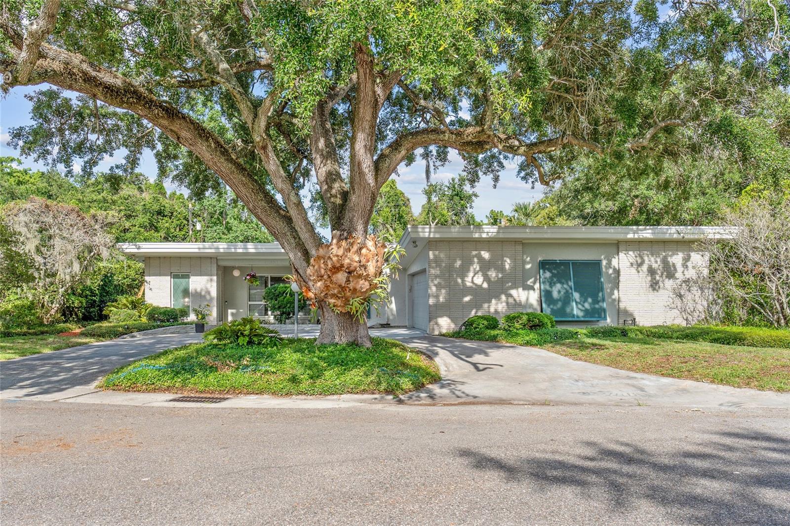 Step into timeless style and modern comfort in this stunning 3-bedroom, 3-bathroom Mid-Century Modern home nestled in the heart of Winter Park. Designed with character and functionality in mind, this unique residence features abundant natural light, clean architectural lines, and a striking pass-through fireplace that creates the perfect ambiance between living spaces.

Enjoy true Florida living with a private backyard pool, ideal for relaxing or entertaining year-round. The home also includes deeded access to a private dock and boat ramp, making boating on beautiful Lake Killarney just steps from your door.

Perfectly positioned for convenience and lifestyle, this property is just a 6-minute drive to the upscale shopping and dining of Park Avenue, only 10 minutes from Downtown Orlando and Camping World Stadium, and approximately 35 minutes from Walt Disney World. Whether you're seeking a stylish primary residence or a one-of-a-kind Central Florida retreat, this home delivers the perfect blend of location, design, and lifestyle.

Call to schedule your showing today!