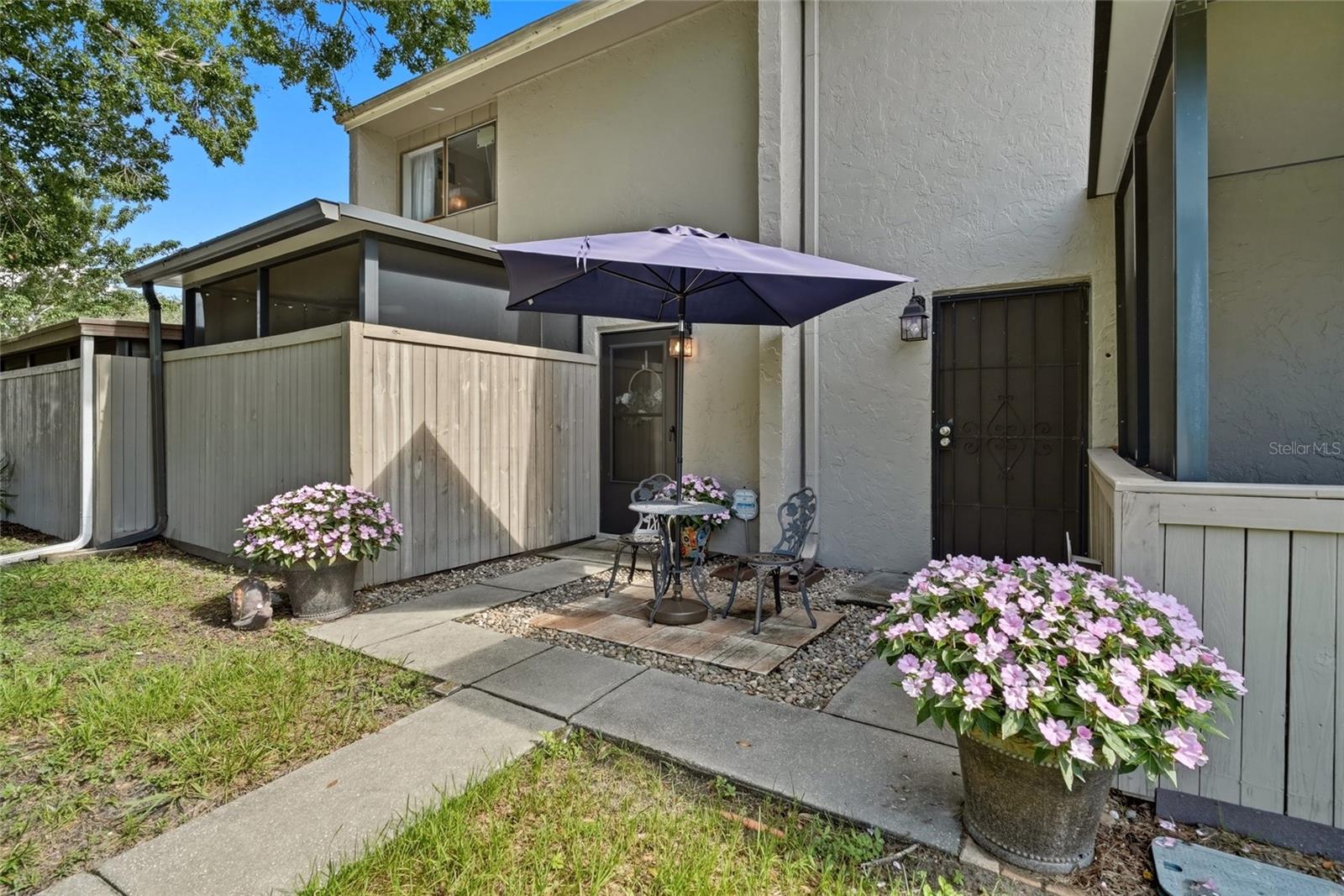 Welcome home to a beautifully updated two-story condo where thoughtful renovations, comfortable living spaces, and inviting outdoor areas come together to create a place that is easy to enjoy from the moment you arrive. With two bedrooms, one-and-a-half bathrooms, two screened and covered patios, and a dedicated carport space, this home offers a wonderful combination of convenience, privacy, and low-maintenance living.  Step inside and discover a bright, welcoming main level designed for everyday comfort and easy entertaining. All of the home’s common living spaces are conveniently located on the first floor, creating a natural separation between the areas where you gather and the private bedrooms upstairs. New subflooring and luxury vinyl plank flooring flow throughout the home, with durable tile reserved for the bathrooms, giving the interior a fresh, cohesive look that is both stylish and practical.  The recently remodeled kitchen serves as the heart of the home, offering an updated space for preparing everything from quick weekday meals to dinner with friends. Modern finishes, including quartz counters & a marble backsplash, as well as a refreshed design, bring a clean, contemporary feel to the space while complementing the comfortable atmosphere of the surrounding living areas. The main level also includes a beautifully remodeled half bathroom, adding convenience for both residents and guests. One of the standout features of this condo is the opportunity to enjoy Florida living from not one, but two screened and covered patios. These versatile outdoor spaces extend the living area beyond the interior of the home and provide comfortable places to enjoy your morning coffee, relax with a good book, unwind at the end of the day, or enjoy the fresh air while remaining protected from the elements.  Upstairs, the home transitions into a peaceful and private retreat. Both bedrooms are located on the second floor, tucked away from the activity of the main living areas below. This thoughtful layout creates a comfortable sense of separation and privacy at the end of the day. The remodeled full bathroom is also conveniently located upstairs and features updated finishes that give the space a fresh, modern feel.  With recently remodeled bathrooms and kitchen, new subflooring, updated LVP flooring, two screened and covered patios, and a dedicated carport space, much of the work has already been done. Whether you are looking for a full-time residence, a seasonal Florida getaway, or simply a home that offers a comfortable layout with less exterior maintenance, this condo is ready to welcome its next owner.  Enjoy the ease of condo living without sacrificing the space and separation of a two-story floor plan. From the updated interior to the private upstairs bedrooms and inviting screened outdoor spaces, this home offers a comfortable setting for everyday life and relaxed Florida living. Schedule your private showing and come see everything this updated condo has to offer!