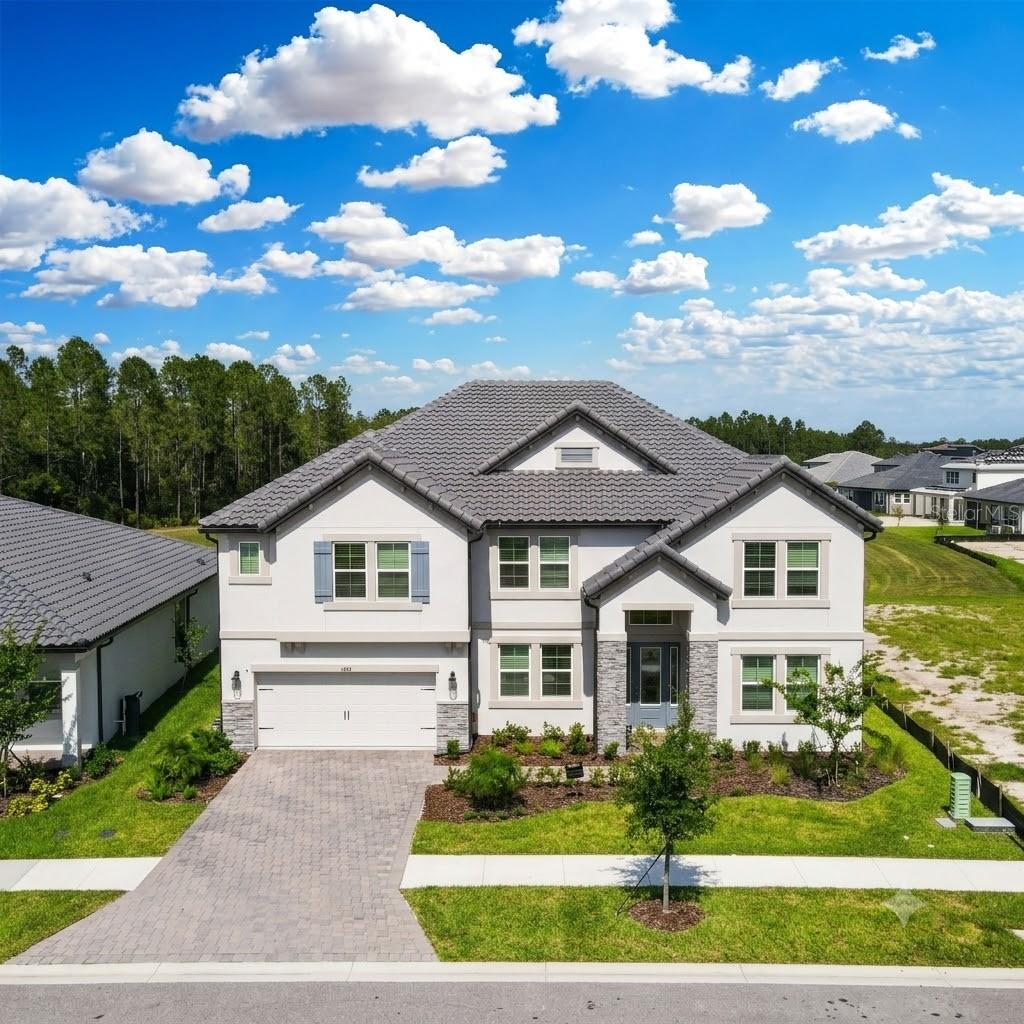 Luxury Redefined: The Pinnacle of Modern Elegance at Two Rivers

Welcome to this spectacular estate located at 1952 Drummond Point in the highly sought-after enclave of Shortgrass at Two Rivers. Sprawling across an impressive 5,452 square feet of meticulously designed living space, this masterpiece skillfully pairs uncompromised luxury with absolute functionality. Craftsmanship meets unique design in this magnificent 2-story residence, utilizing the iconic Grandsail III floorplan.

Positioned on a premier waterfront lot, this exceptional property offers an enhanced level of privacy with no immediate backyard neighbors. Enjoy peaceful evenings taking in beautiful sunsets looking out at the serene pond in the back—a true backyard oasis.

Step inside a bright, airy interior that immediately establishes an ambiance of modern elegance and charm. At the heart of the main floor sits a chef’s dream kitchen—a true culinary sanctuary equipped with sleek, high-end finishes, premium appliances, and expansive workspaces perfect for both intimate family meals and lavish social gatherings.

Designed for ultimate comfort and privacy, this luxurious home features six generously sized bedrooms, highlighted by a rare and coveted master suite tucked away on the first floor. The home boasts four full bathrooms and two halves, each impeccably styled with quality fixtures and designer finishes. Entertainment options abound with a dedicated media room and an additional game room upstairs, providing endless versatility for a home theater, or private office

Practical luxury continues with a spacious 3-car garage, offering substantial space for your vehicle collection and additional storage needs.

Beyond your private oasis, the community offers unparalleled resort-style living at The Landing. This premier waterfront clubhouse complex features a massive zero-entry pool with a multi-story water slide, a separate competitive lap pool, an elite racquet sports center with 6 tennis and 8 pickleball courts, and beautifully landscaped parks with modern playground facilities.

Don't miss the opportunity to experience this unparalleled lifestyle firsthand. Schedule your private tour today to come and see everything this exceptional property has before it's gone!