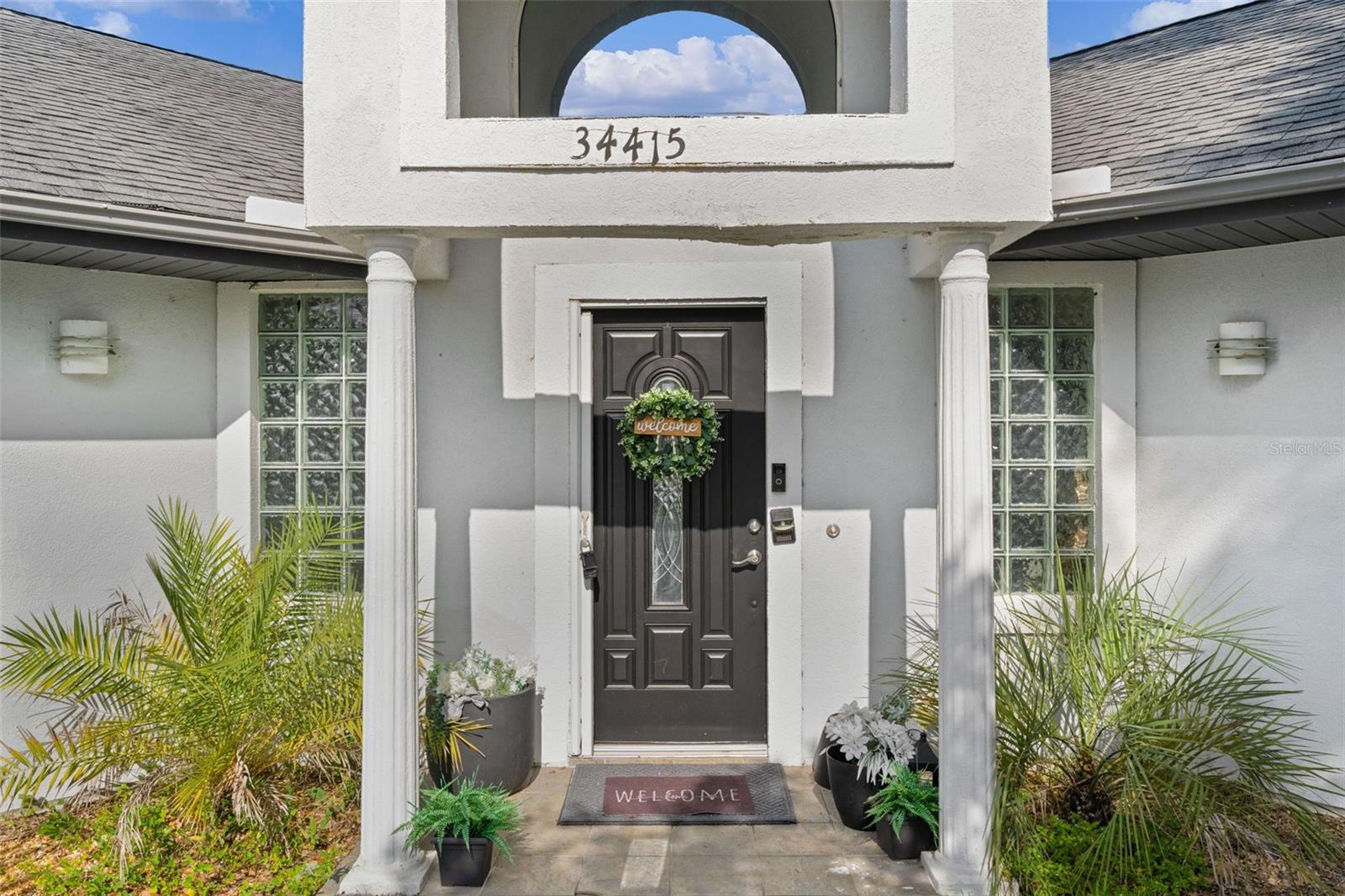 Not your typical cookie cutter Florida home
The centerpiece of this unique home is the screen-enclosed courtyard pool located right in the heart of the residence, creating a private resort-style setting unlike anything else. Nearly every major living area offers views of or direct access to the pool, making it easy to enjoy Florida's indoor-outdoor lifestyle from almost anywhere in the home.

Inside, you'll find an open floor plan with soaring volume and cathedral ceilings that create a bright, spacious feel throughout. With 4 bedrooms and 4 bathrooms, there's plenty of room for family and guests.

Perfect for entertaining, the outdoor living area features a fully equipped outdoor kitchen overlooking the pool. The detached pool house serves as a fully functional apartment complete with its own entrance, full bathroom, refrigerator, and stove—ideal for guests, multi-generational living, a home office, or private retreat.

Situated on a corner lot, this property offers easy access to the shopping, dining, golf, and entertainment of The Villages while remaining within a reasonable drive of the boutiques, restaurants, and waterfront charm of historic downtown Mount Dora.

This is a rare opportunity to own a home that combines flexible living space with exceptional outdoor living.